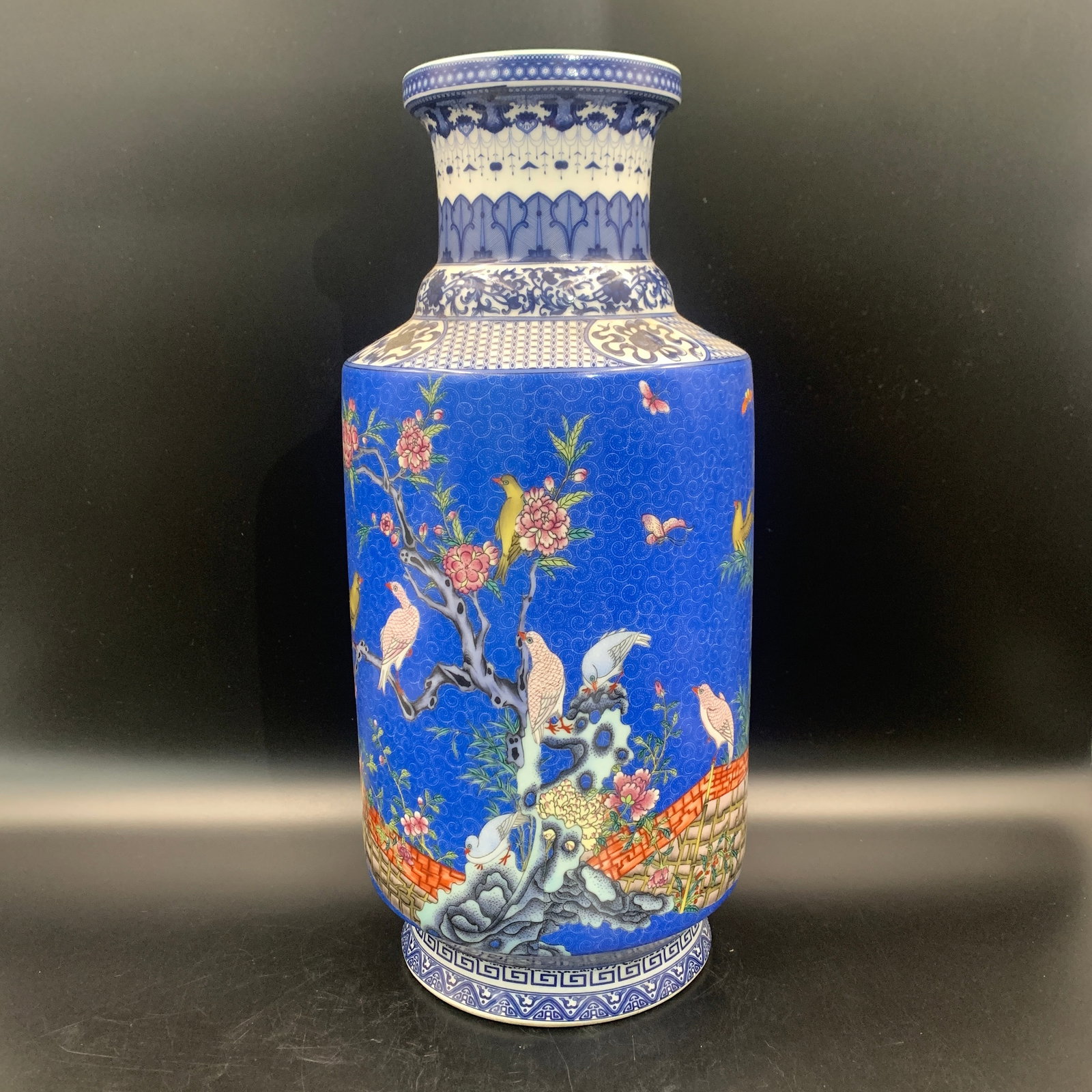 COBALT BLUE-GROUND PORCELAIN VASE WITH FLOWER AND BIRD PATTERN: Qing Dynasty; High: 16.4 inch; Diameter: 7.6 inch; . Wooden base for display only