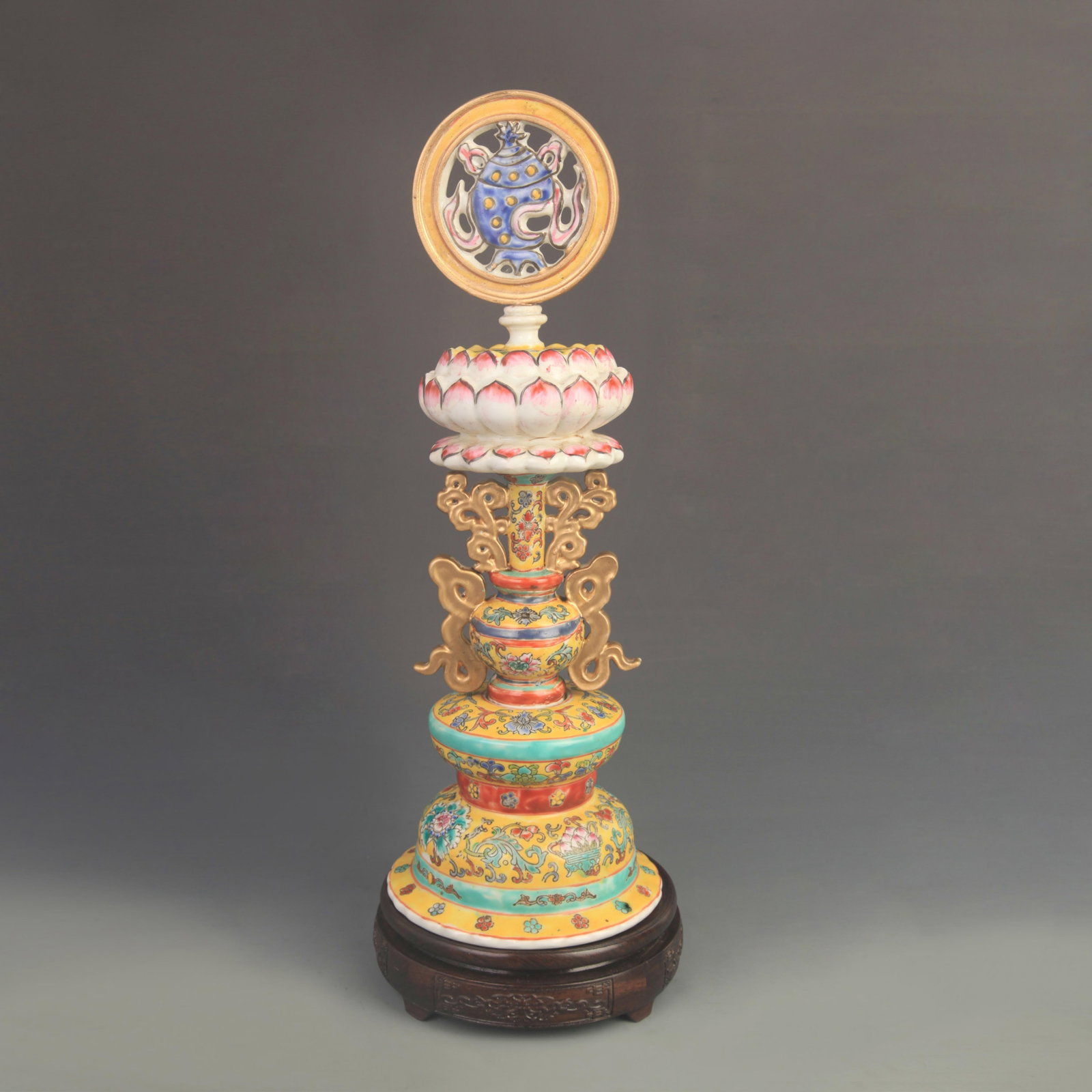 A YELLOW-GROUND FAMILLE ROSE PANEL WITH FOUR BUDDHIST EMBLEMS: Qing Dynasty Qian Long Period; High: 16.5 inch;Diameter: 5.80 inch; . Wooden base for display only