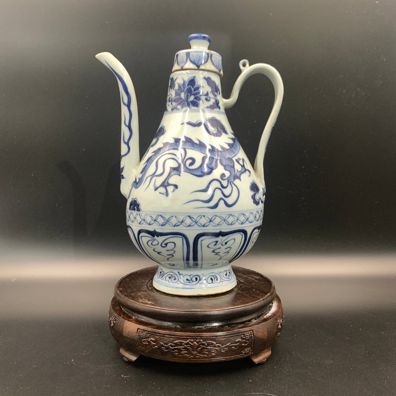 BLUE AND WHITE DRAGON PATTERN PORCELAIN EWER: Ming Dynasty Style; Long: 6.9 inch; Width: 5 inch; High: 9.3 inch; . Wooden base for display only