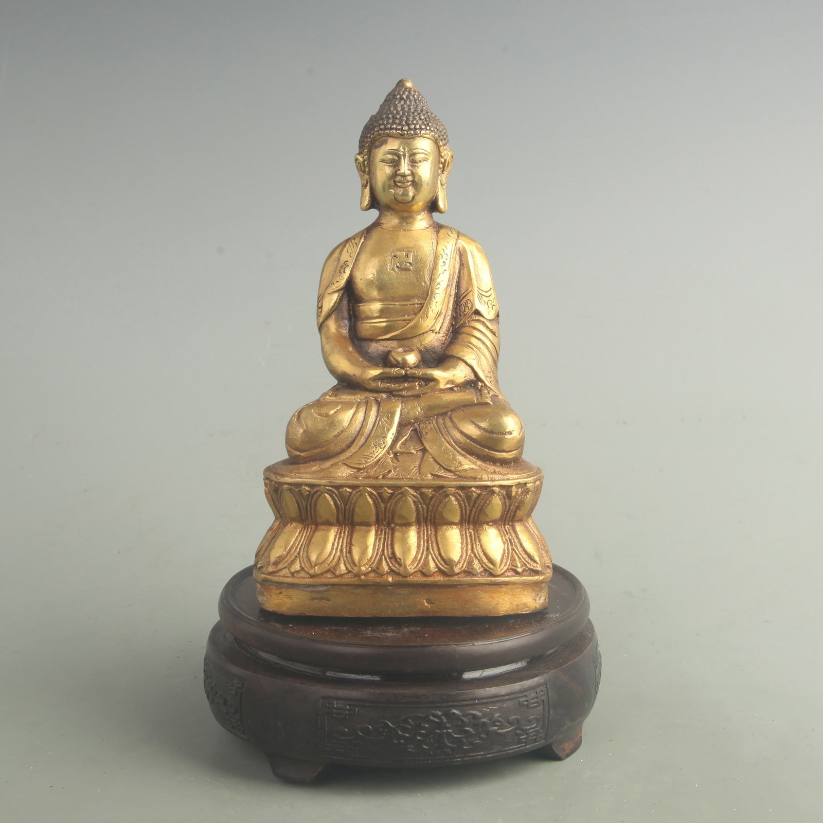 A FINE GILT BRONZE AMITAYUS BUDDHA STATUE: 20th Century; High: 7.10 inch; High: 4.00 inch; . Wooden base for display only