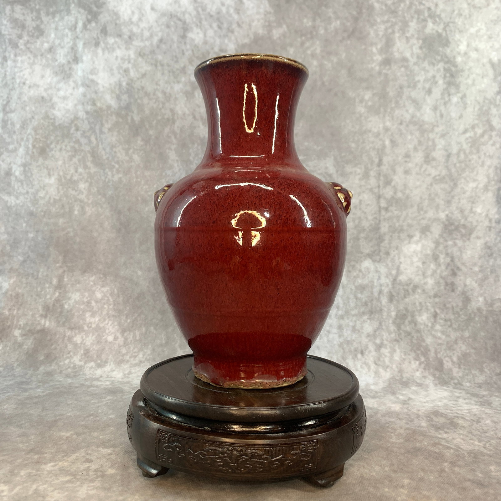 A FINE RED-GLAZED OXBLOOD (SANG-DE-BOEUF) PORCELAIN VASE: Ming Dynasty Style; Long: 5.7 inch; Width: 5.4 inch; High: 8.5 inch; . Wooden base for display only