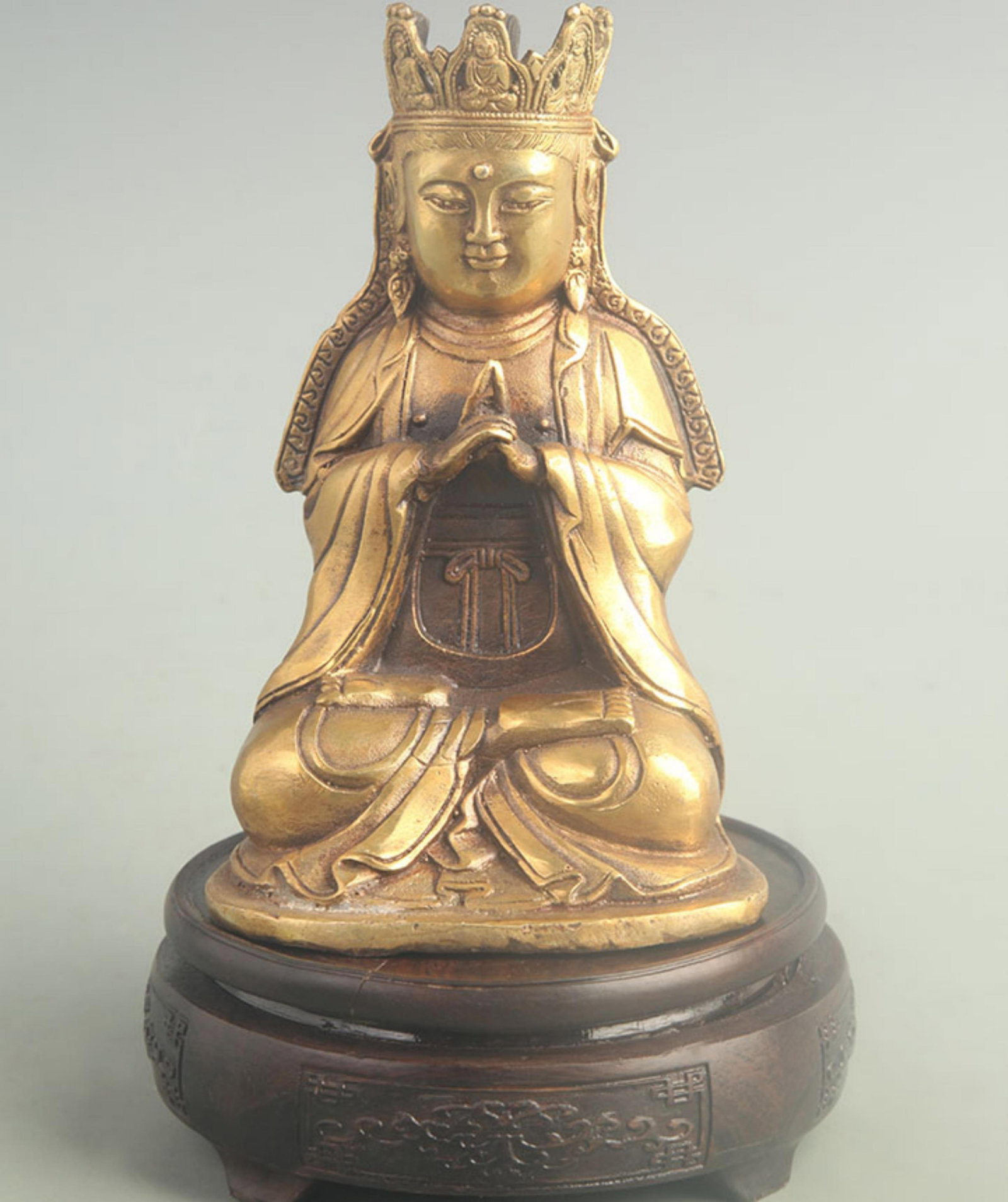BRONZE GILT AND GOLD-PLATED SEATED STATUE OF AVALOKITESVARA: 20th Century; High: 7.00 inch; Width: 3.50 inch; Long: 4.20 inch; . Wooden base for display only