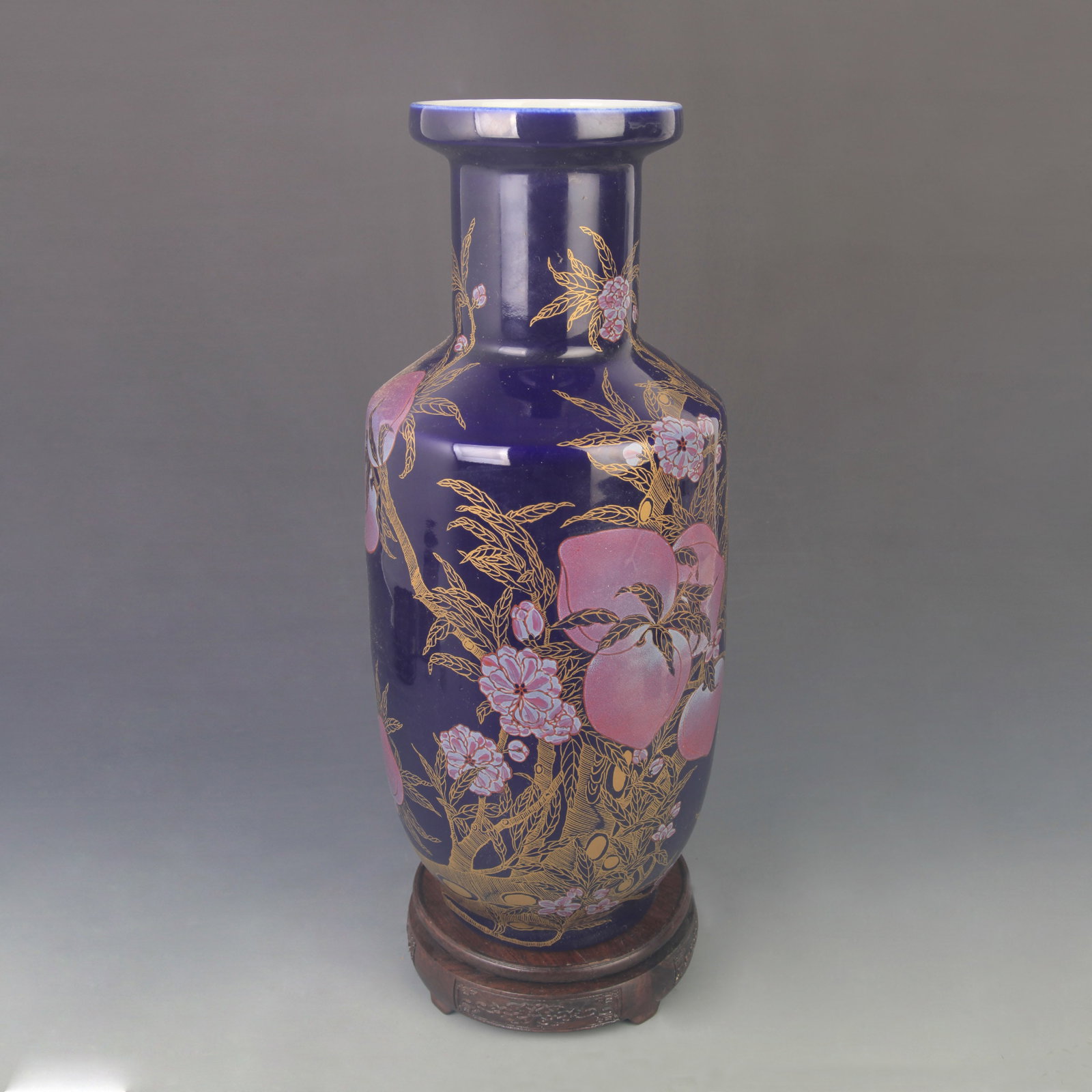 DARK BLUE ENAMELED PORCELAIN ROULEAU VASE: Qing Dynasty Kang Xi Period; High: 16.3 inch; D: 6.80 inch. Wooden base for display only