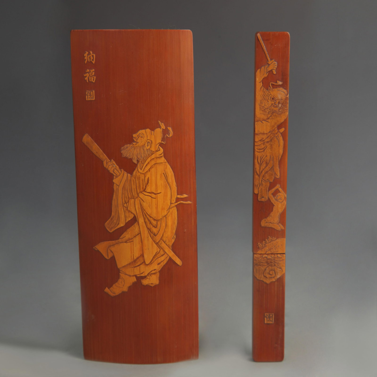 BAMBOO ARMREST WITH "BODHIDHARMA CROSSING THE RIVER" DESIGN AND PAPER KNIFE SET: 20th Century; Long: 7.00 inch; Width: 0.75 to 2.50 inch. Wooden base for display only