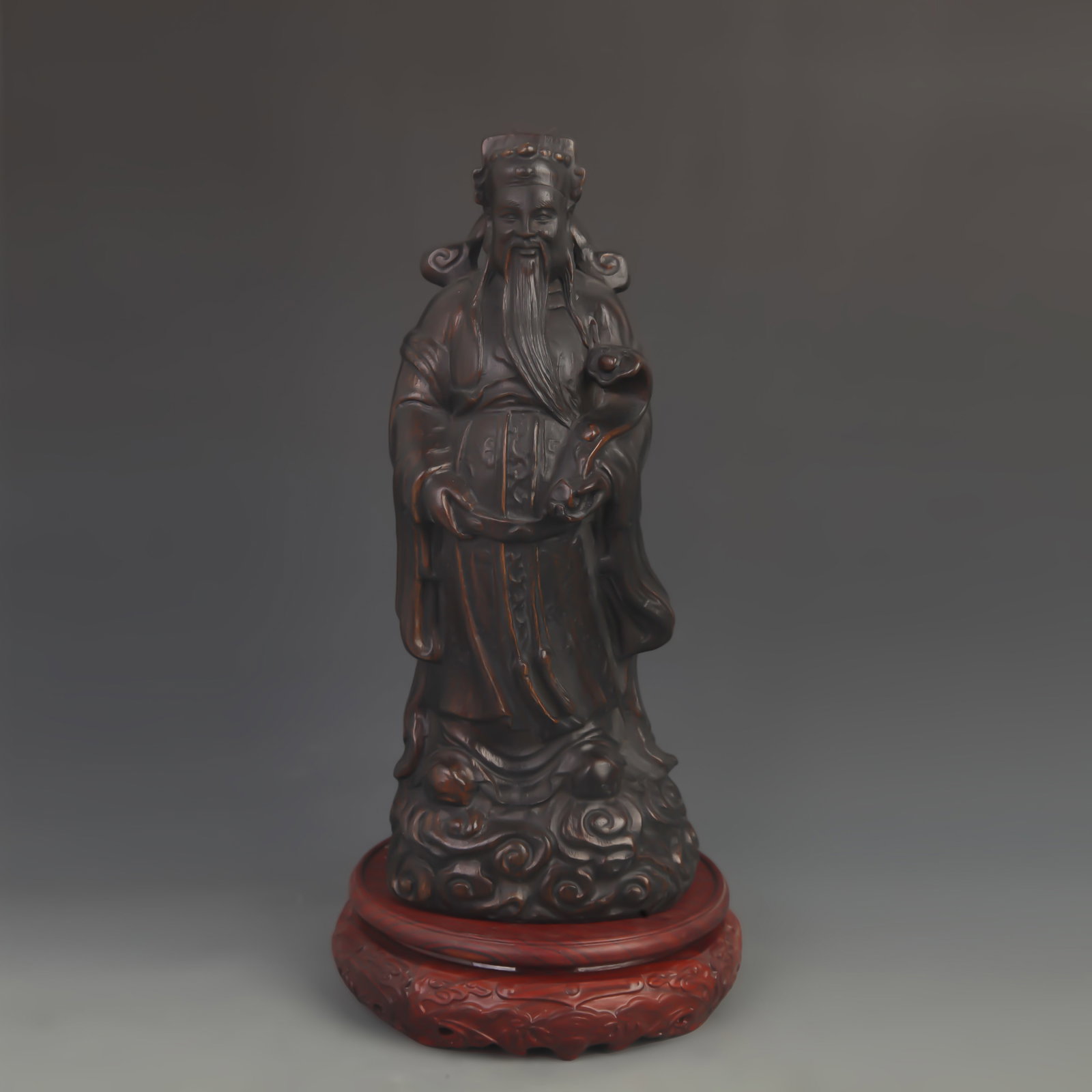 A FINE BAMBOO MADE GOD OF WEALTH FIGURE