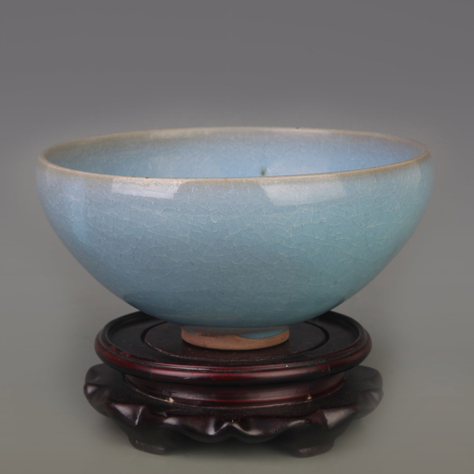 A JUN KILN PORCELAIN BOWL: Song Dynasty Style; Diameter: 6.8 inch; High: 3.4 inch. Wooden base for display only