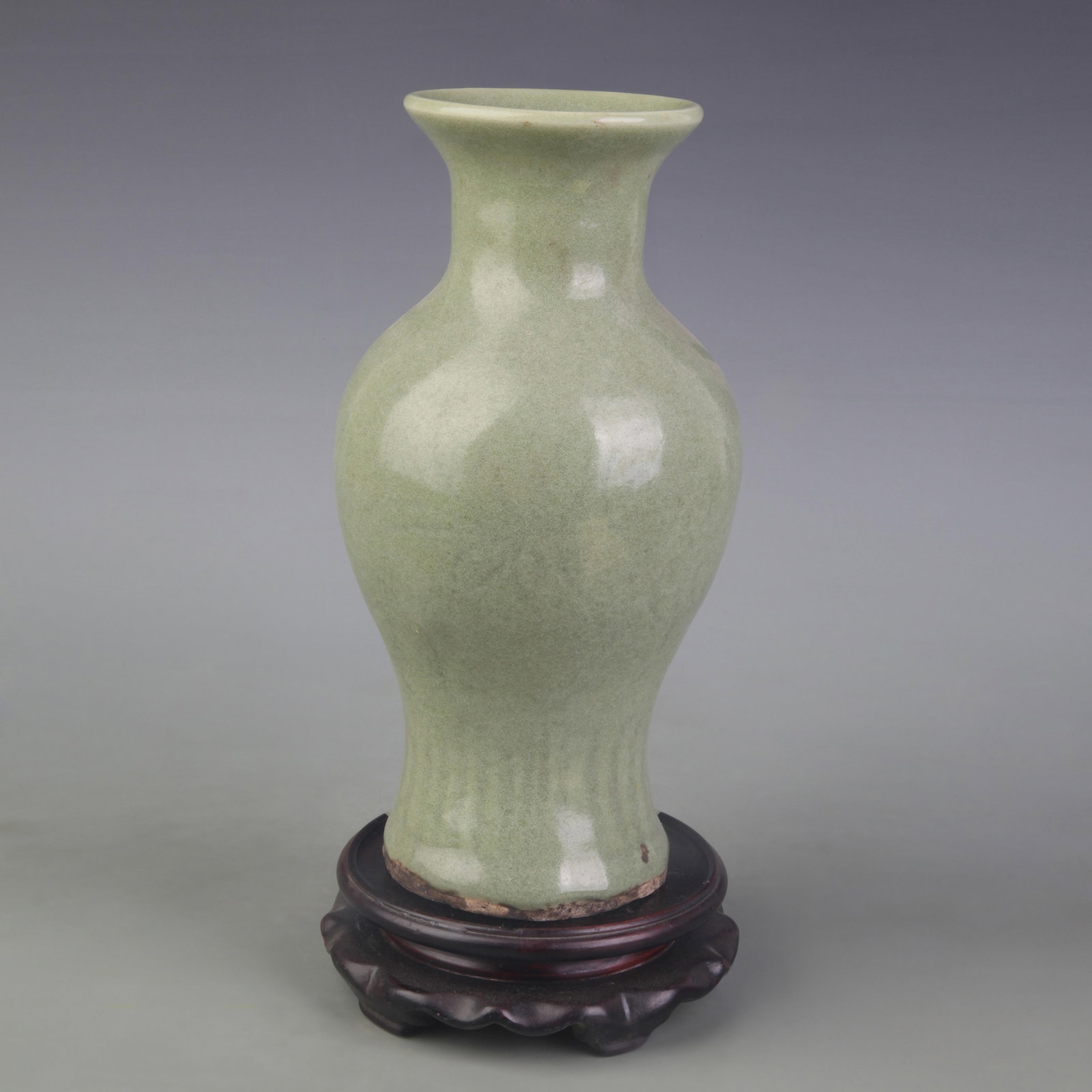 LONGQUAN CELADON VASE WITH INCISED FLORAL DECORATION: Ming Dynasty Style; D: 3.4 in ; High: 9.4 in. Wooden base for display only
