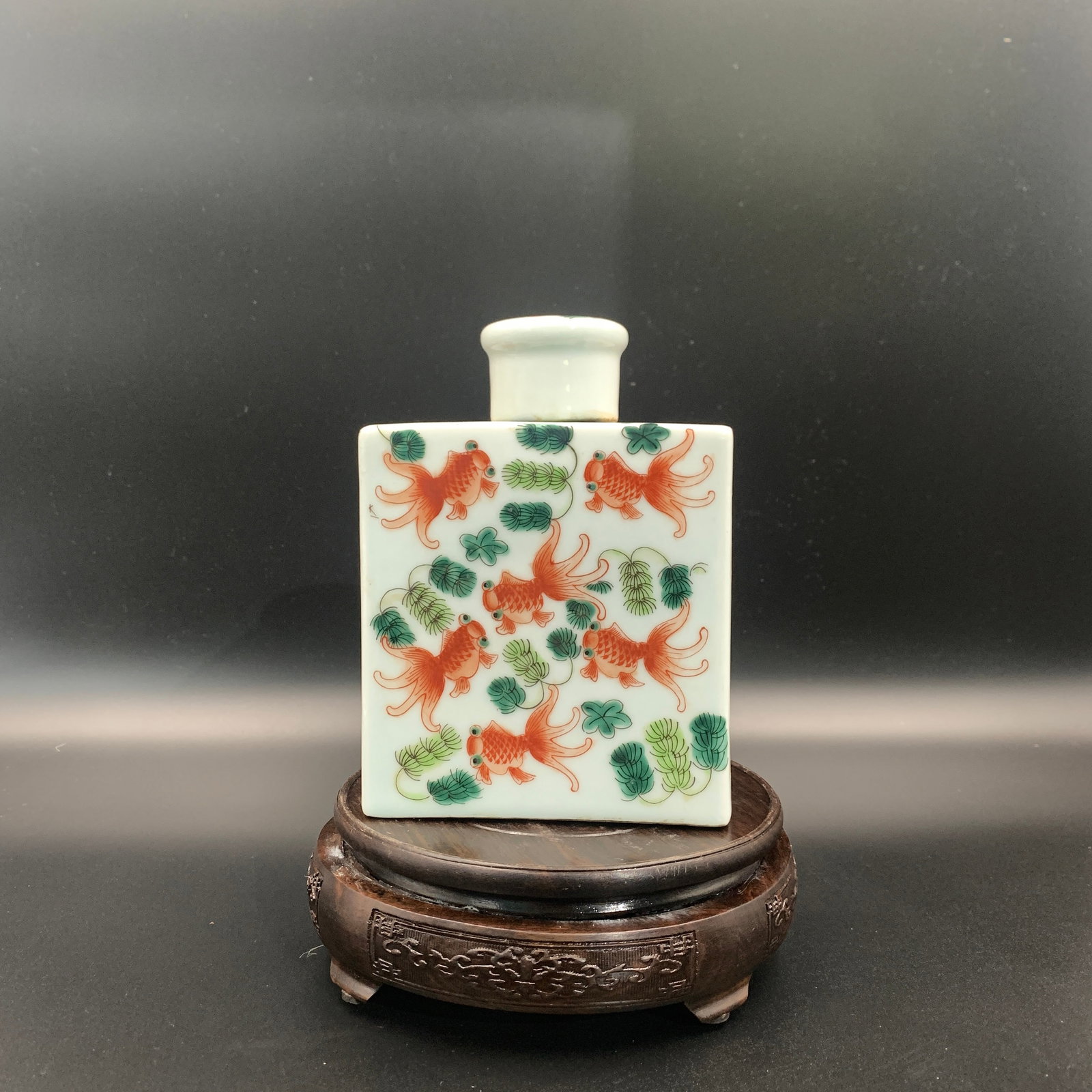RED ENAMELED GOLDFISH PORCELAIN TEA JAR: Qing Dynasty; Long: 4.7 inch; Width: 2.8 inch; High: 6.4 inch; . Wooden base for display only