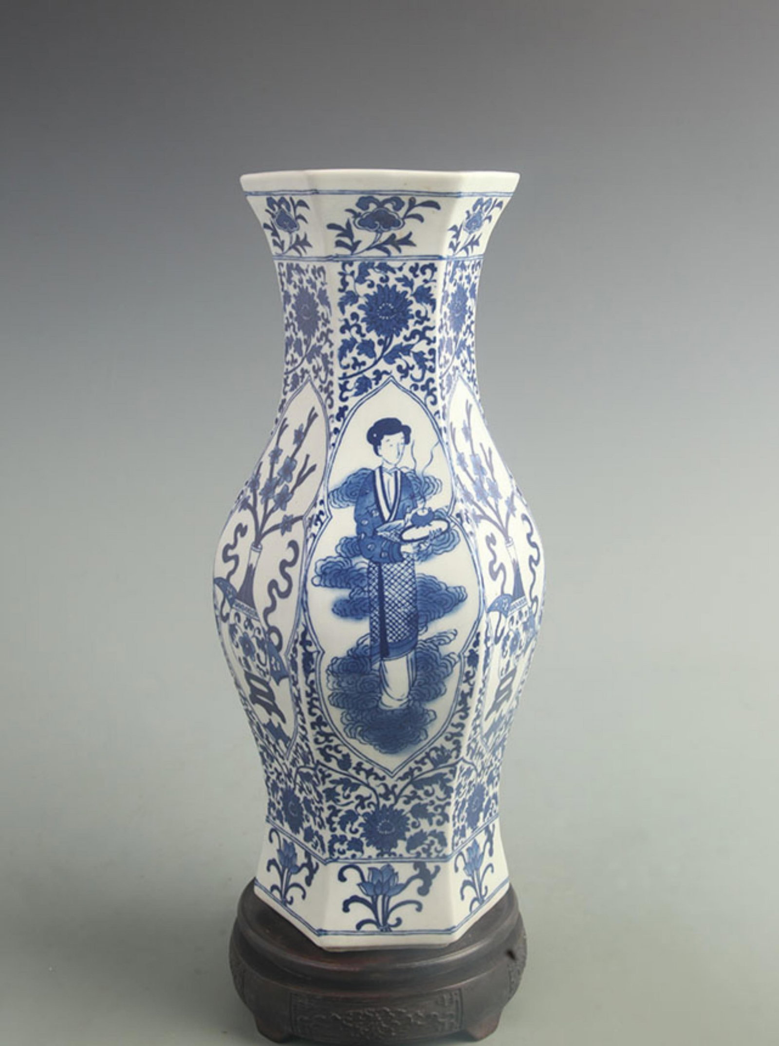 A BLUE AND WHITE HEXAGONAL VASE WITH FIGURAL AND FLORAL PANELS