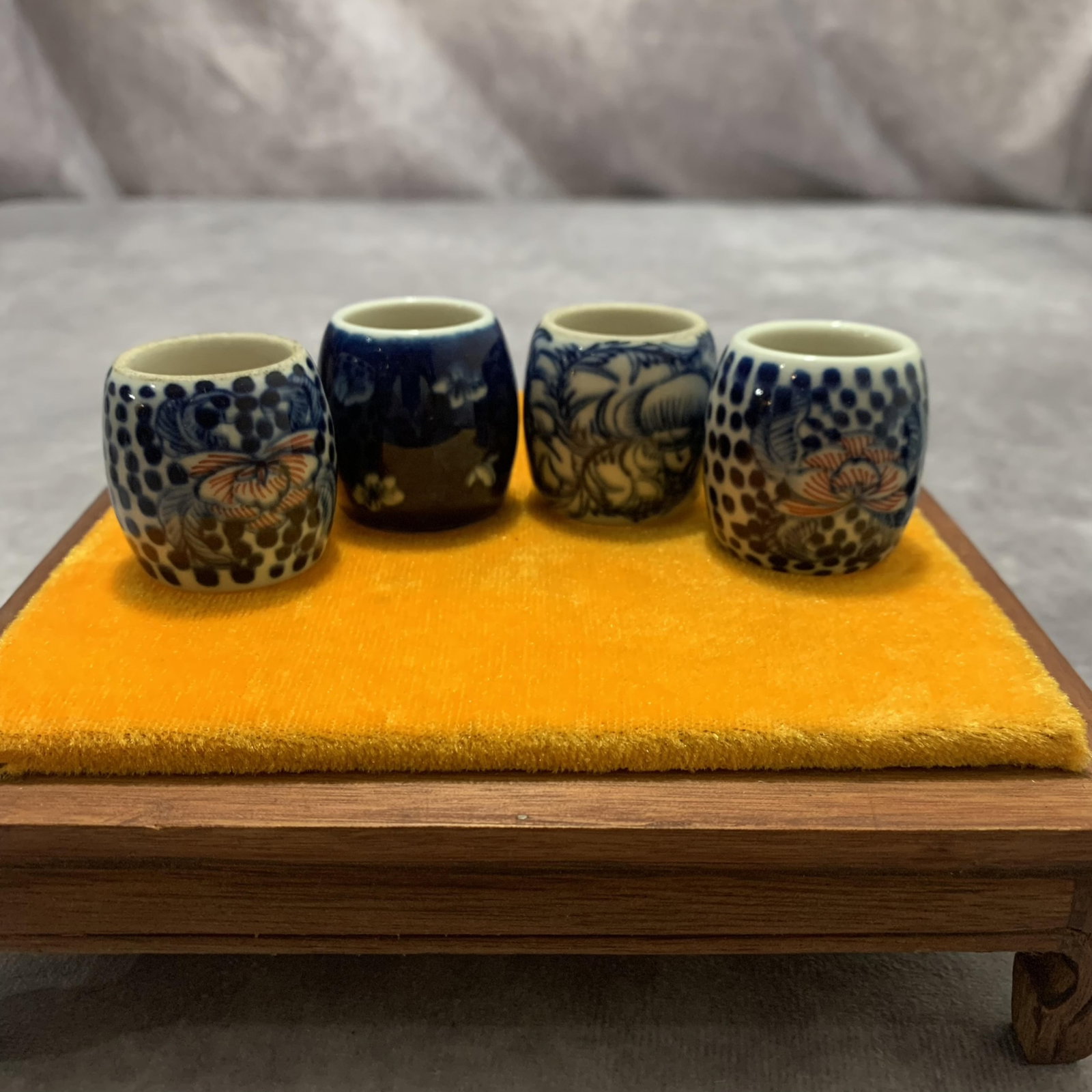 GROUP OF FOUR SMALL PORCELAIN BIRD FOOD JAR