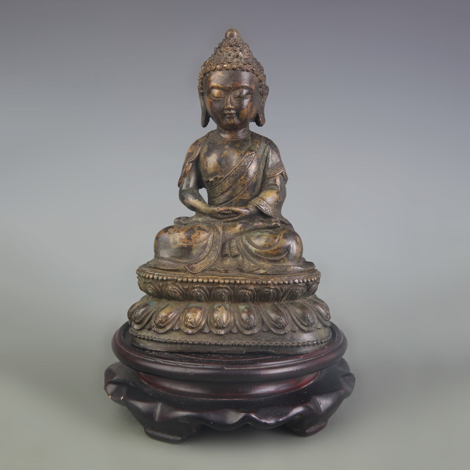 A FIGURE OF SHAKYAMUNI BUDDHA: Qing Dynasty; High: 6.2 inch. Wooden base for display only
