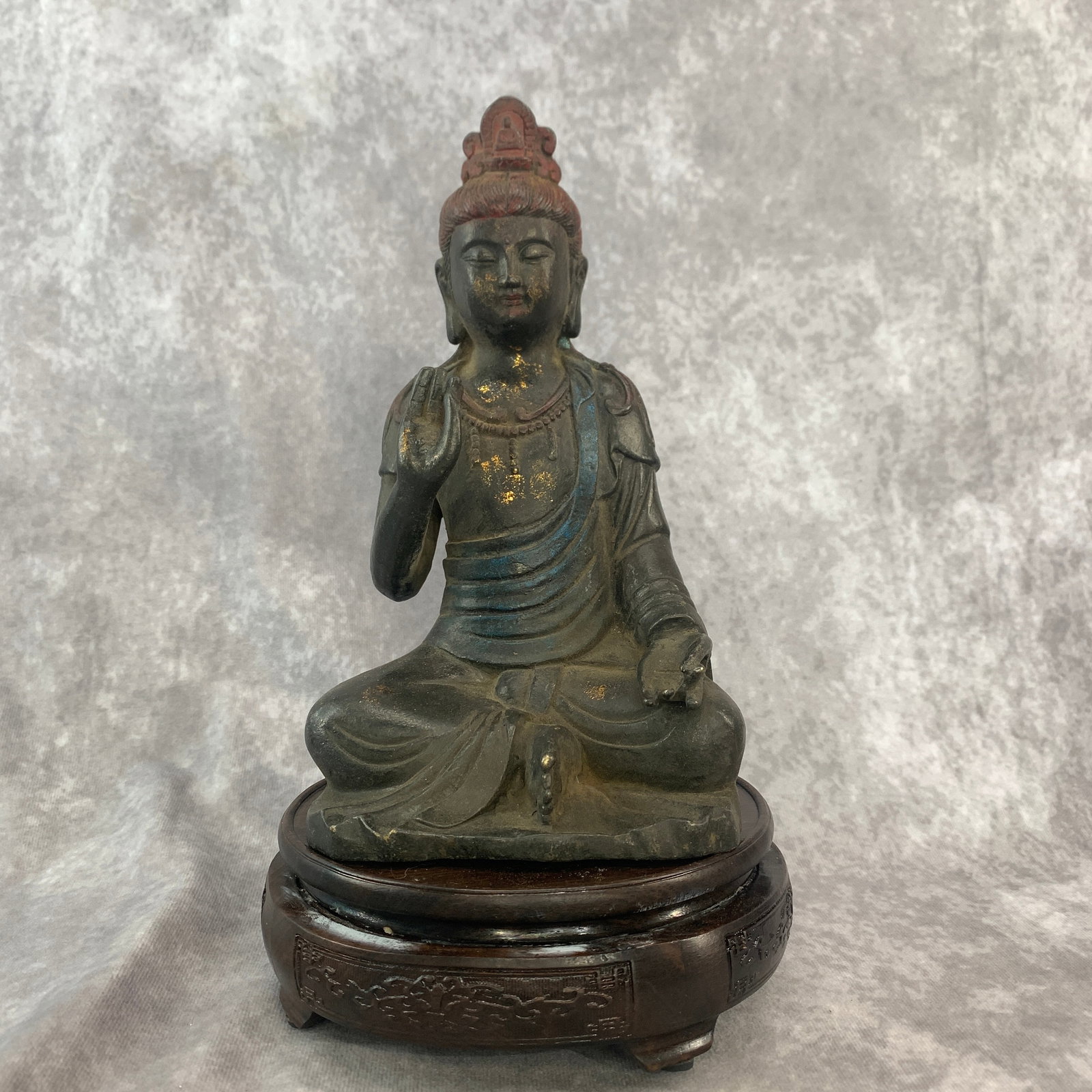 PARTIAL-GILT AND LACQUERED BRONZE FIGURE OF THE BODHISATTVA GUANYIN: Qing Dynasty; Long: 5.1 inch; Width: 4.6 inch; High: 9.1 inch; . Wooden base for display only