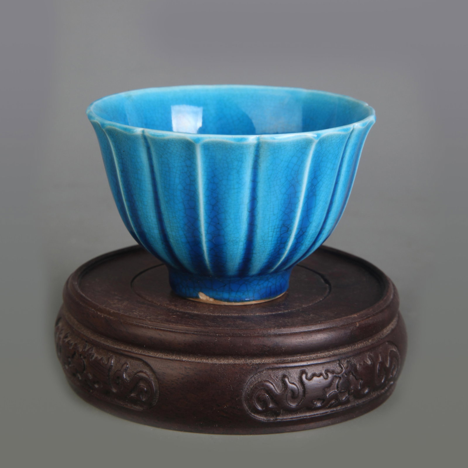 A FINE BLUE GLAZE SMALL BOWL: Ming Dynasty Hong Zhi Style; Diameter: 3.0 in ; High: 1.9 in. Wooden base for display only