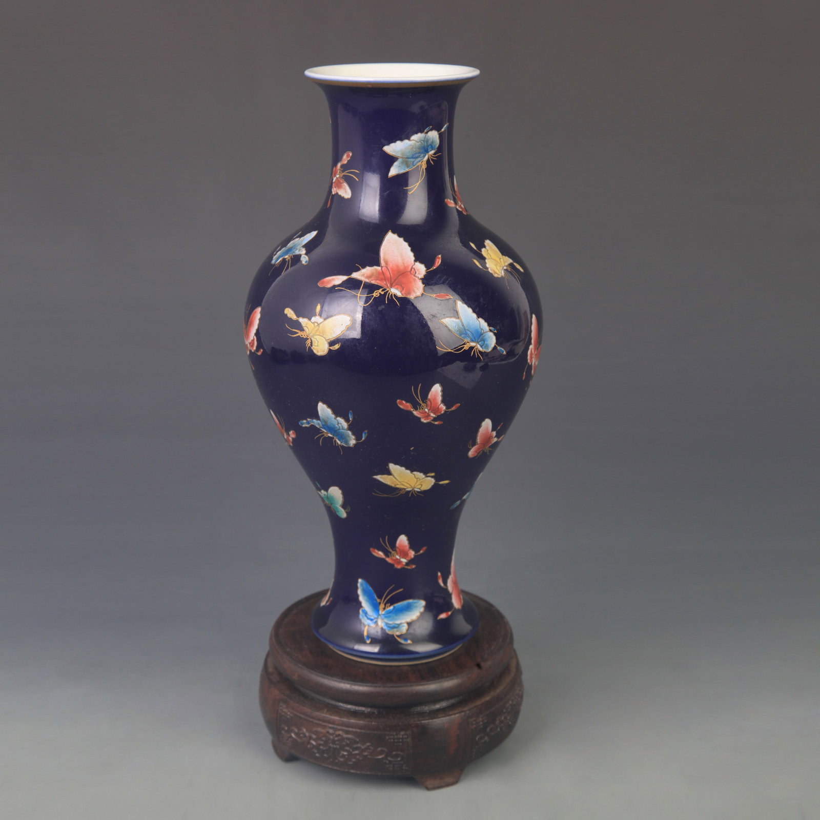 FAMILLE ROSE GUANYIN VASE WITH HUNDRED BUTTERFLIES: Qing Dynasty Yong Zheng Period; High: 10.0 inch; Diameter: 5.00 inch; Wooden base for diplay only