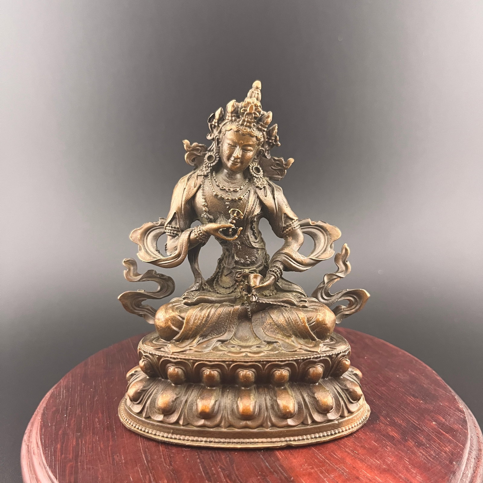A SMALL BRONZE TIBETAN VAJRASATTVA FIGURE: 20th Century; Long: 2.88 inch; Width: 2.04 inch; High: 3.64 inch; Wooden base for diplay only