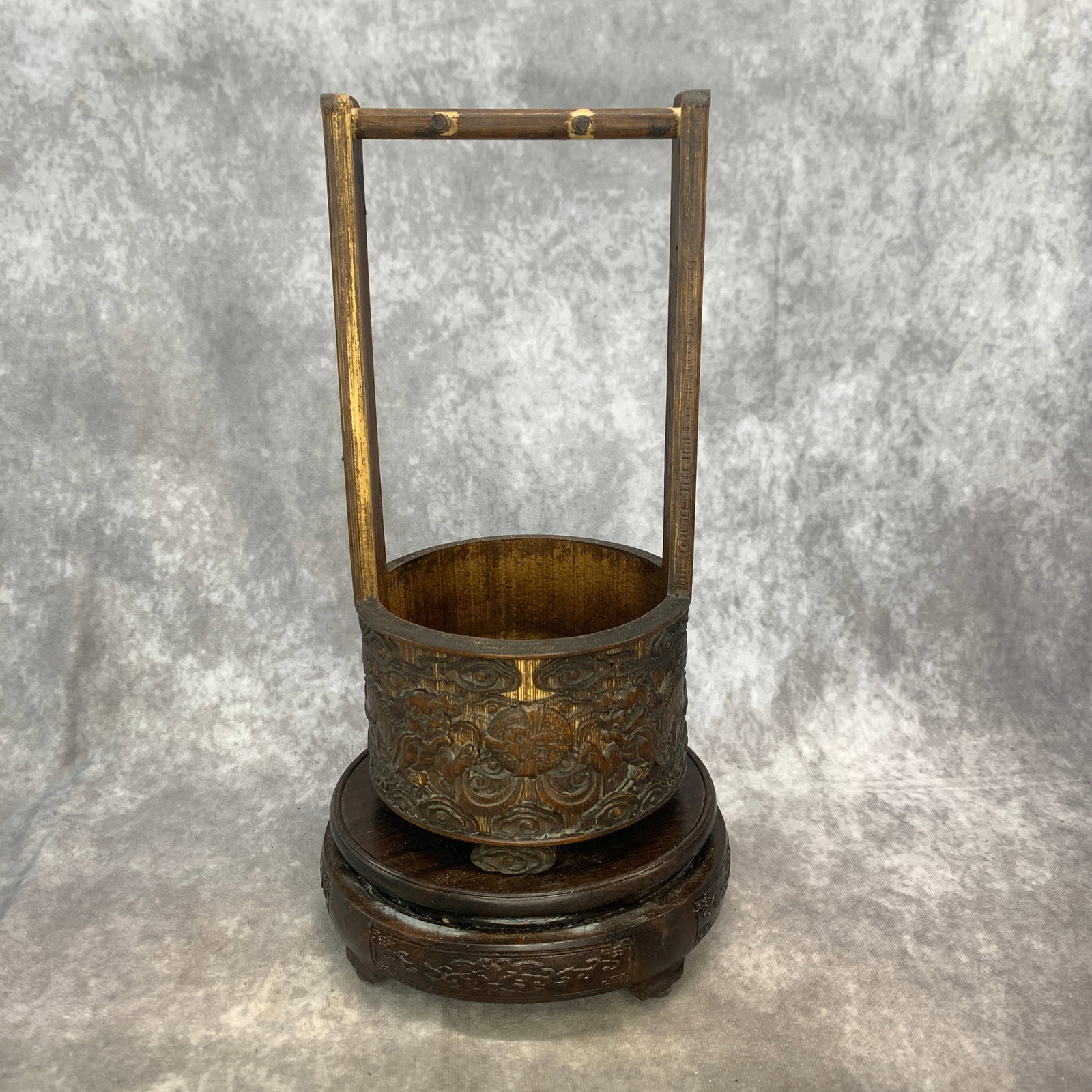 A FINE CARVED BAMBOO-ROOT 'TAOTIE' HANDLE BUCKET