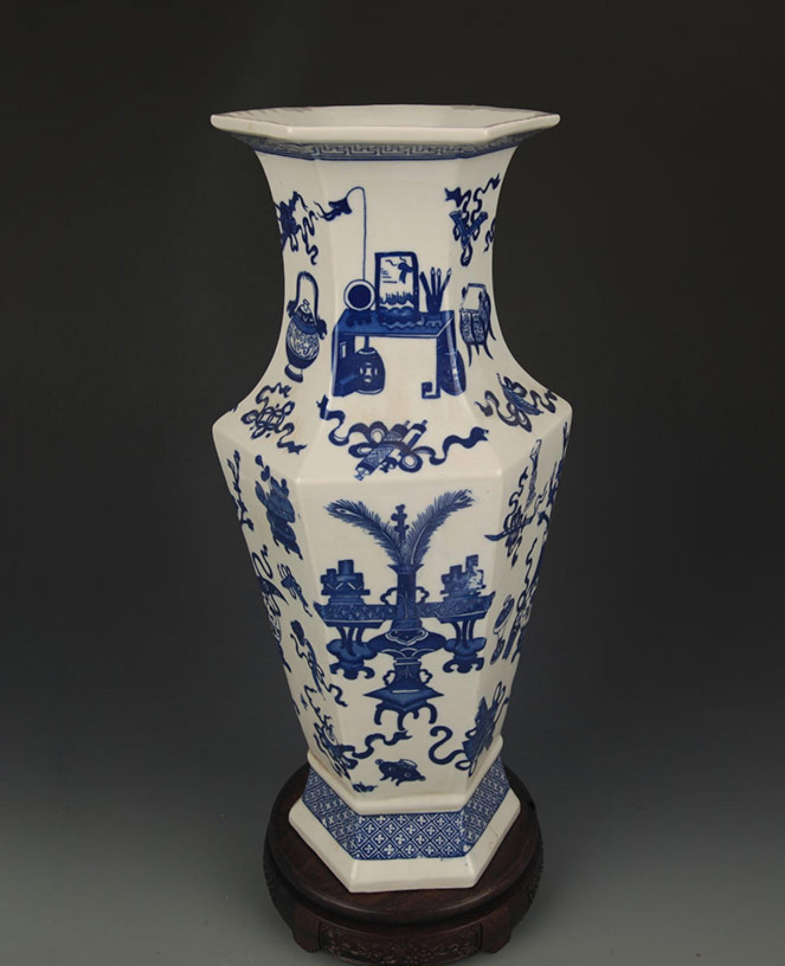 A FINE BLUE-AND-WHITE FLORAL PATTERN SIX-SIDED PORCELAIN VASE: Qing Dynasty Qian Long Period; High: 15.75 inch; Diameter: 6.0 inch; Wooden base for diplay only