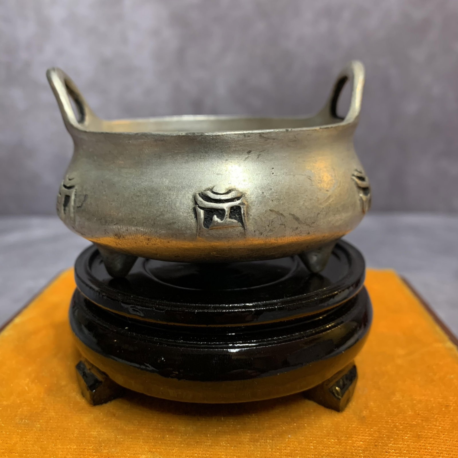A FINELY CARVED WHITE BRONZE CENSER: Qing Dynasty, High: 1.4 inch; Diameter: 3.1 inch; Wooden base for diplay only