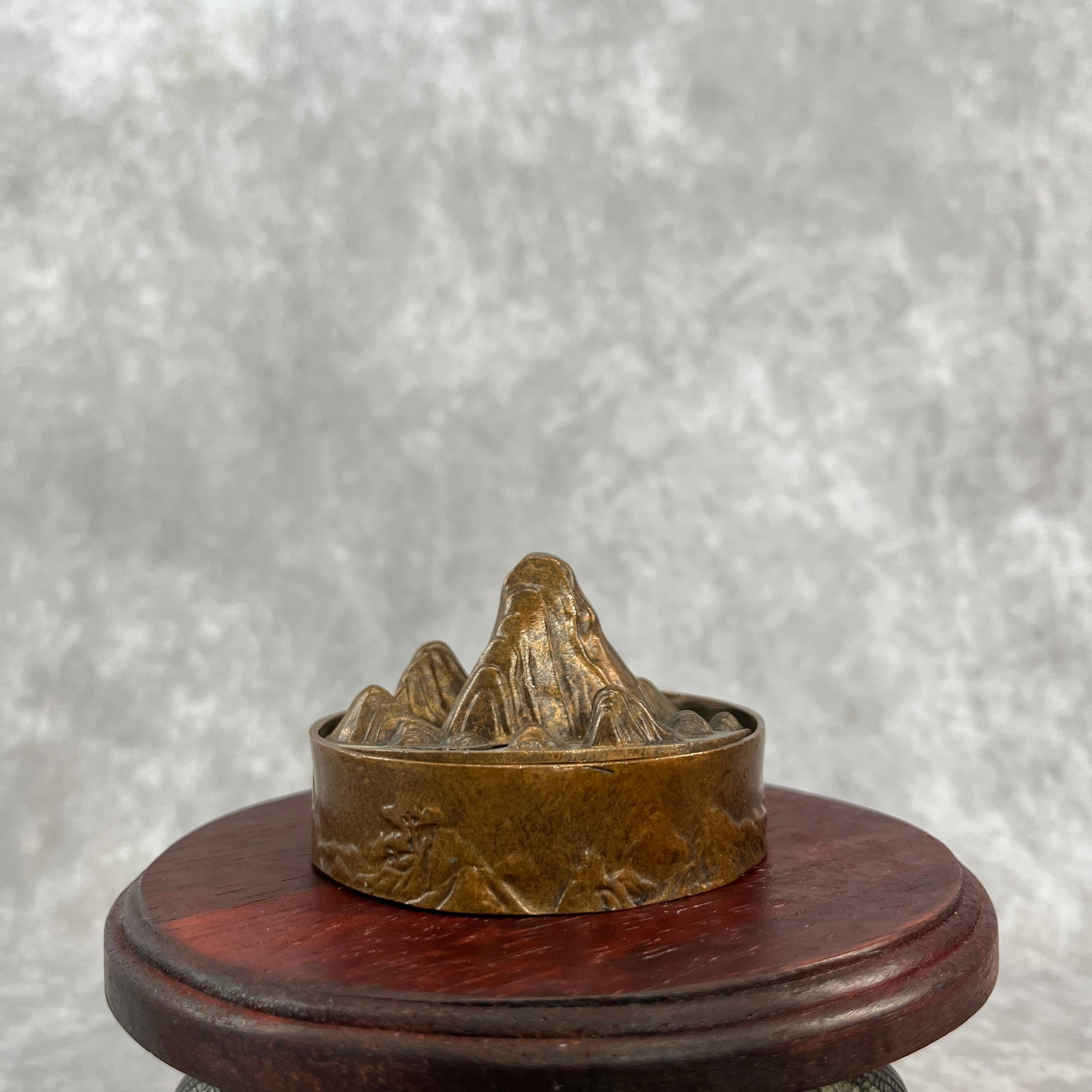 A SMALL BRONZE MOUNTAIN STYLE BRONZE INCENSER BURNER