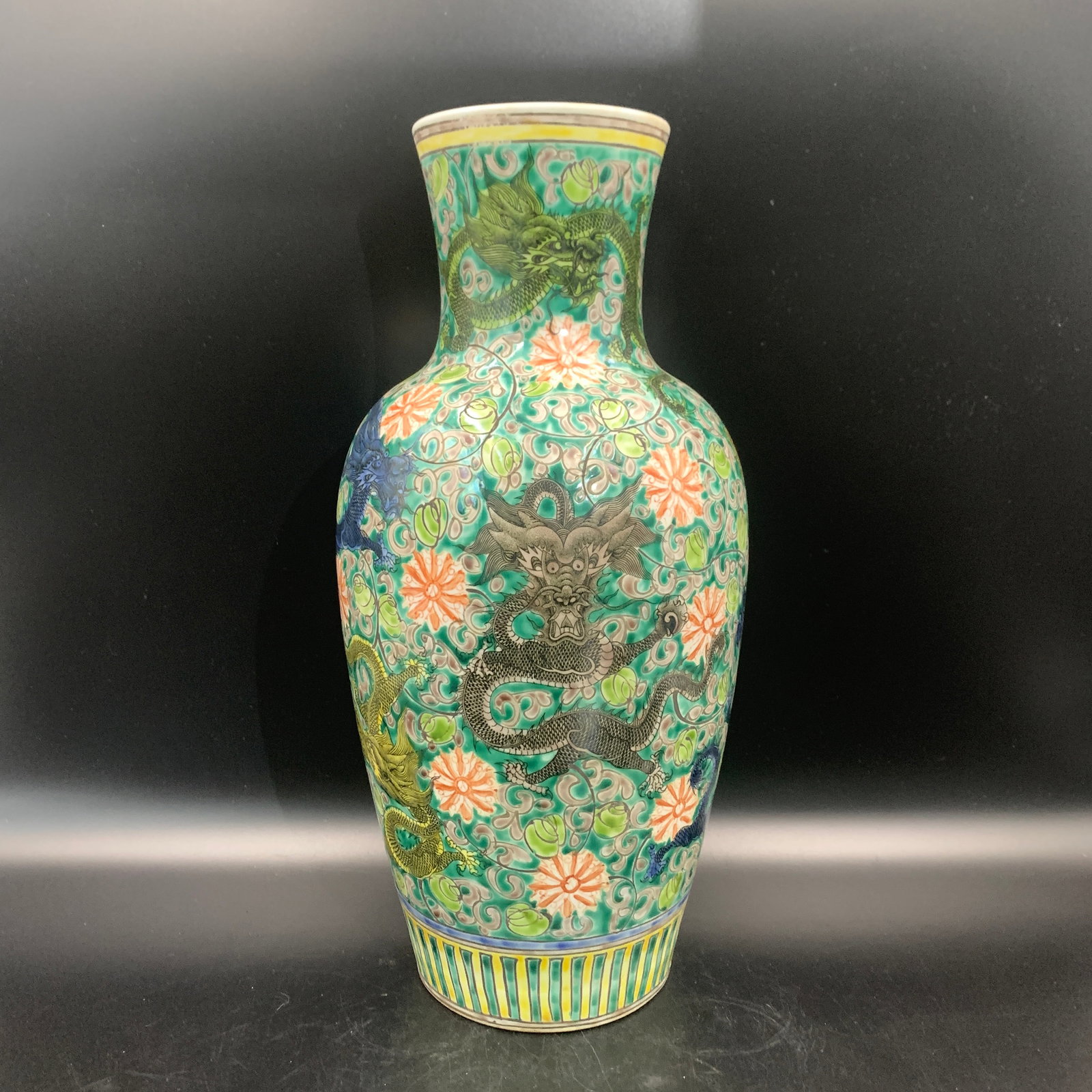A GREEN-ENAMEL GROUND PORCELAIN VASE WITH MULTI-COLORED IMPERIAL DRAGONS
