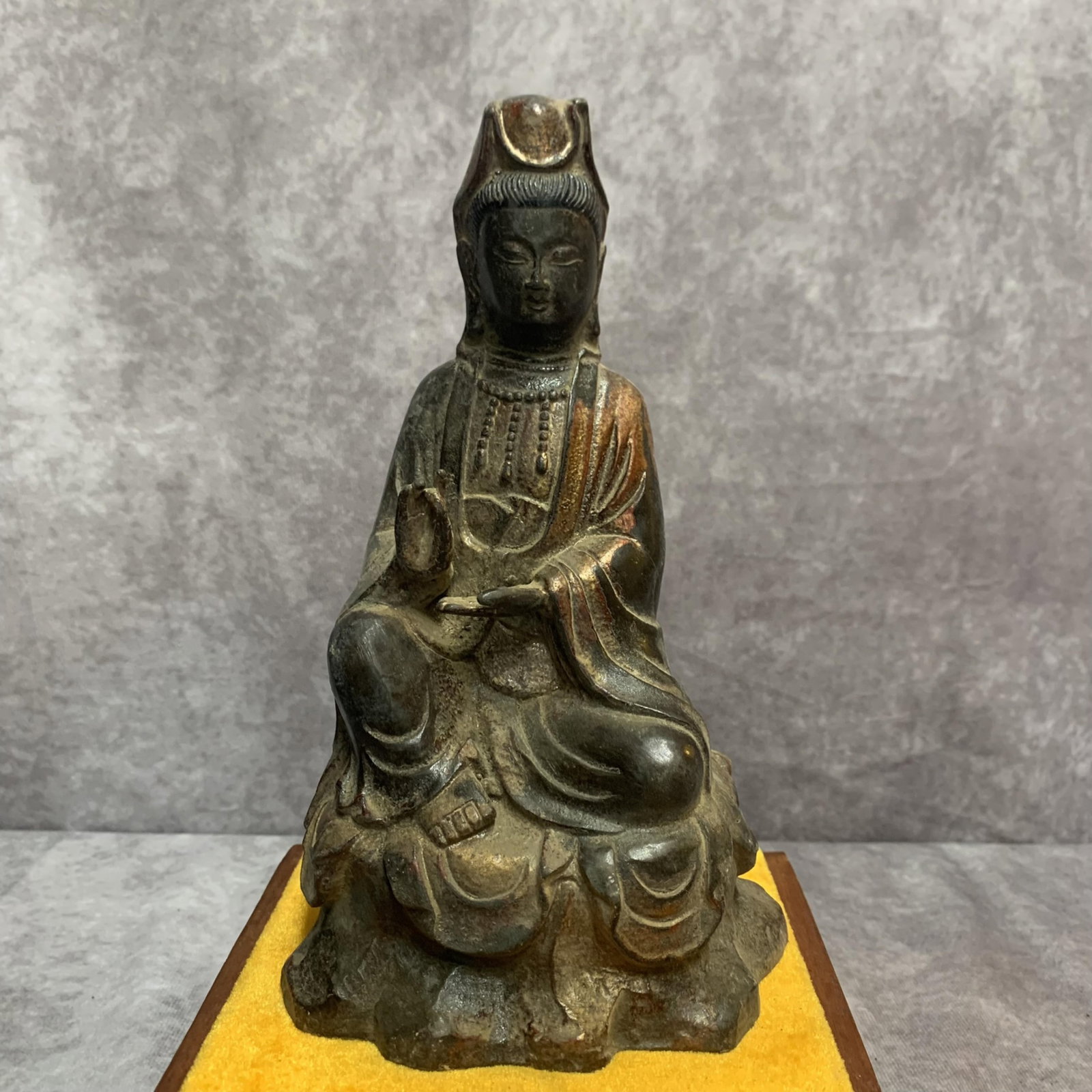 A SMALL BRONZE GUAN YIN BODHISATTVA STATUE: Qing Dynasty; High: 8.9 inch; Width: 5.2 inch; Long: 4.0 inch; Wooden base for diplay only