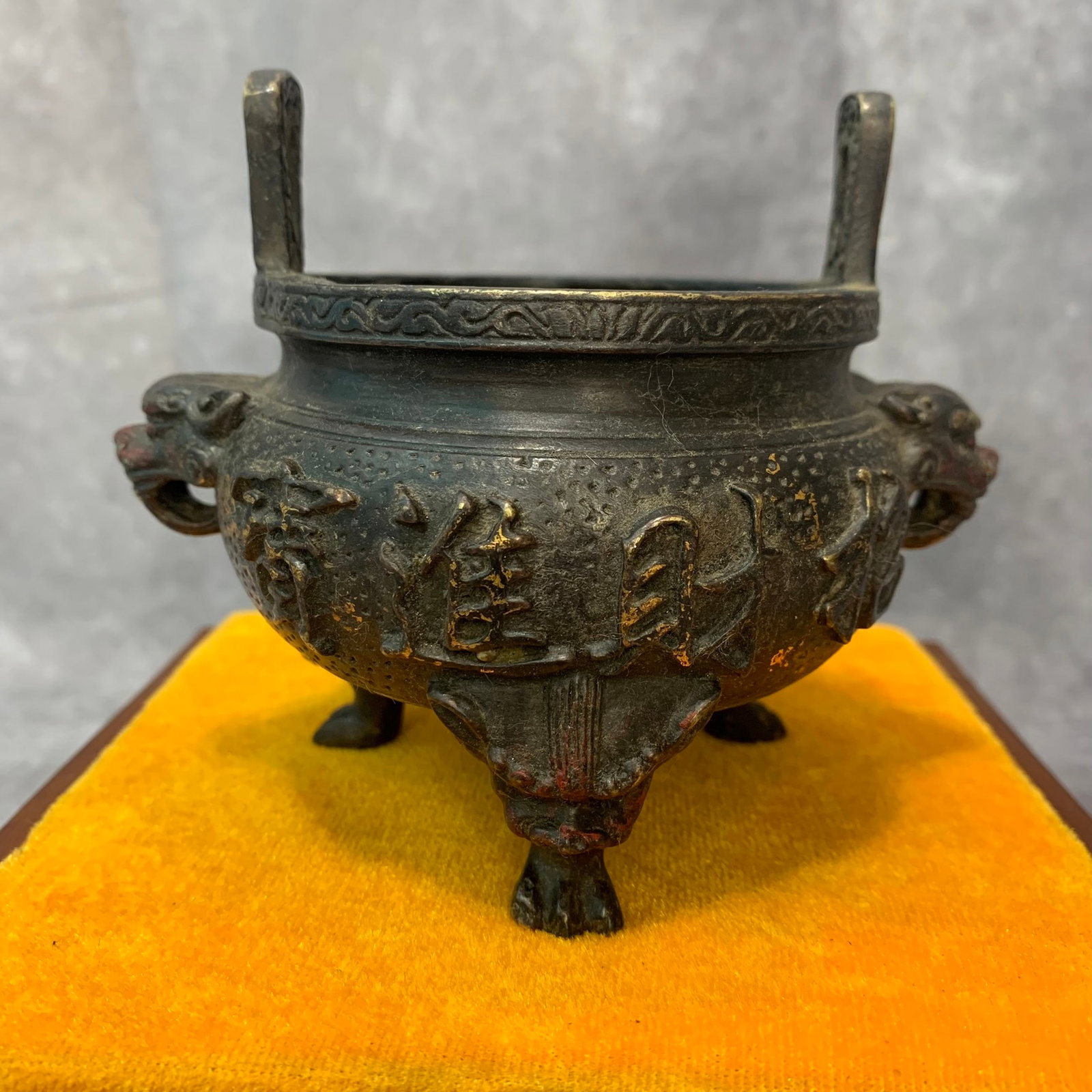 A FINE BRONZE TRIPOD LION HANDLE TALL EAR INCENSE BURNER