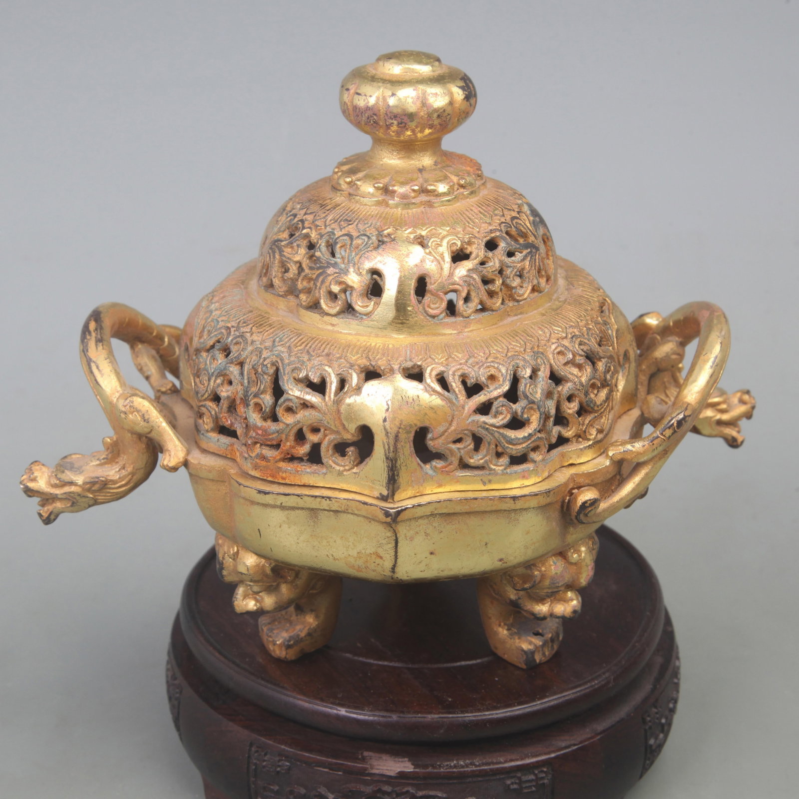 GILT BRONZE INCENSE BURNER WITH DRAGON-SHAPED HANDLES AND THREE FEET
