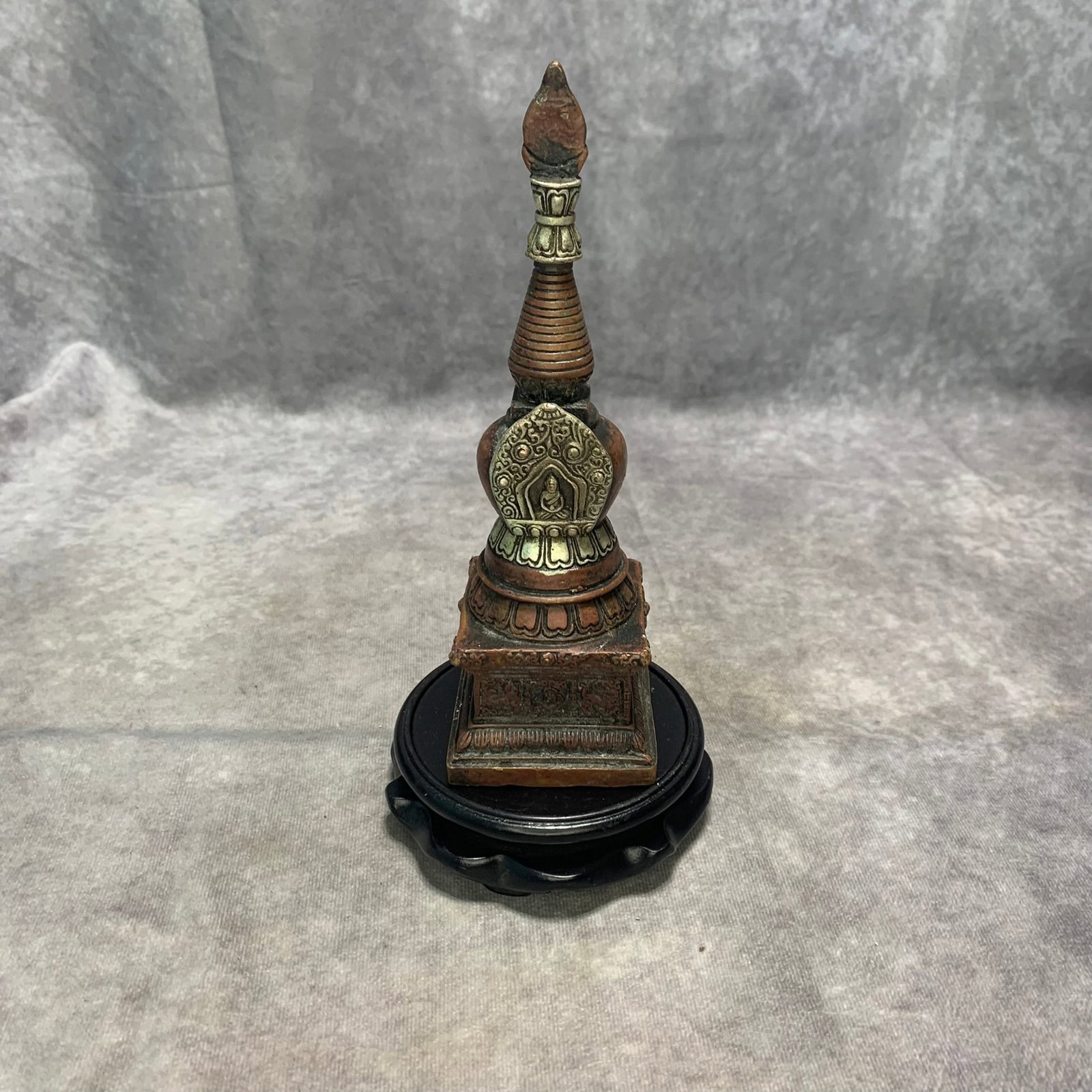 A FINE BRONZE AND SILVER-INLAID BUDDHIST STUPA