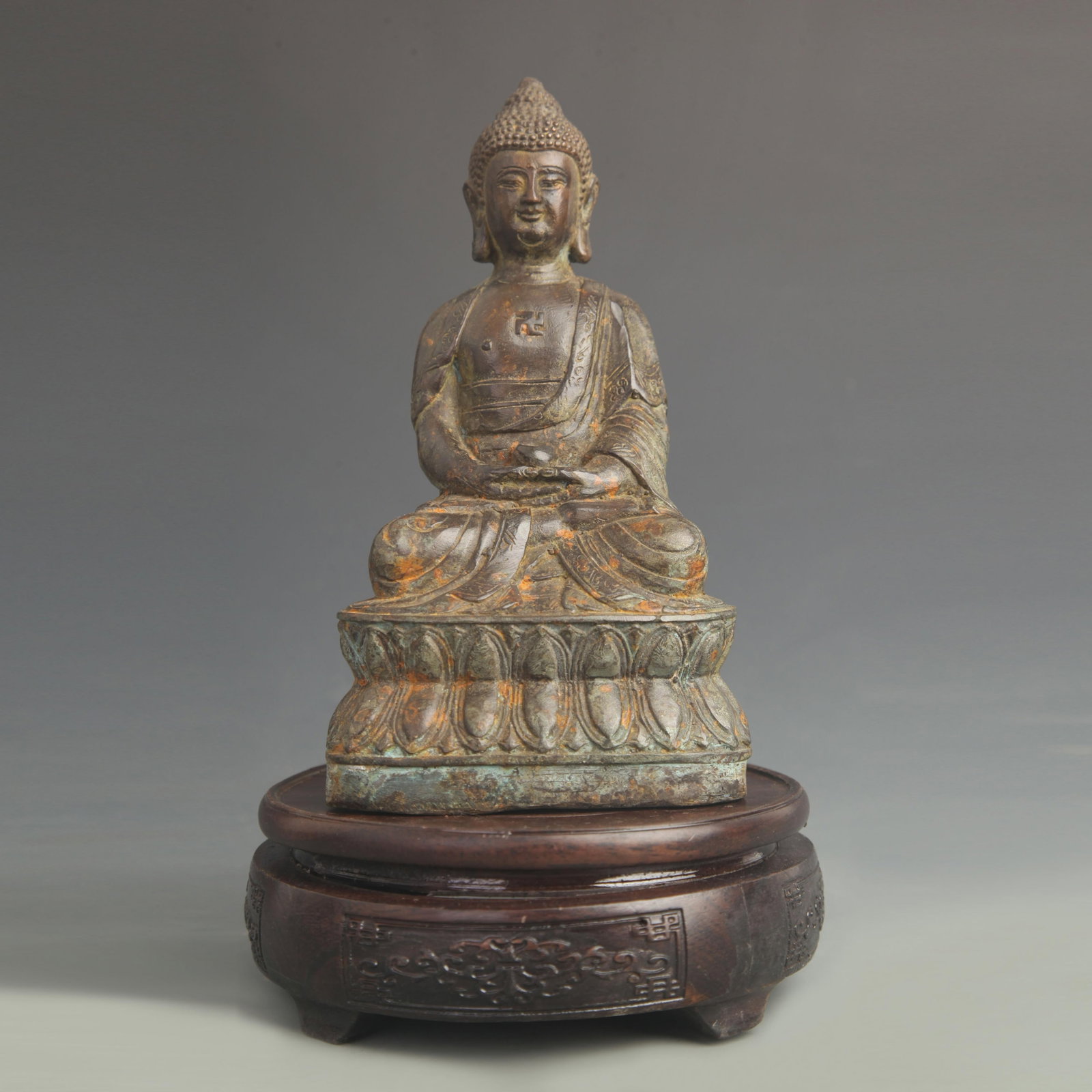 A FINE BRONZE AMITABHA BUDDHA SEATED STATUE: 20th Century; High: 7.50 inch; Width: 3.75 inch; Wooden base for diplay only