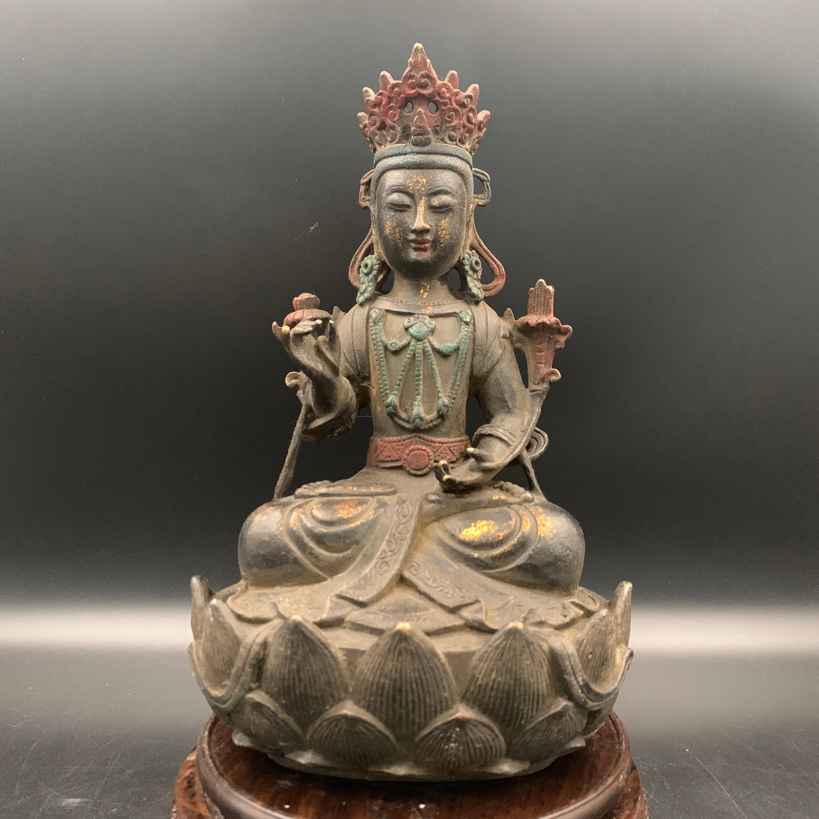 A PARCEL-GILT BRONZE DIORAMA THRONE FIGURE OF A BODHISATTVA
