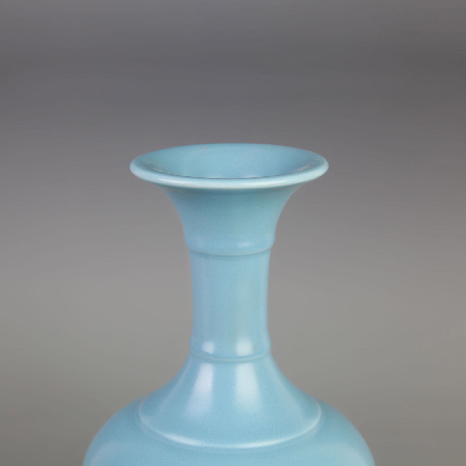 A CLAIRE-DE-LUNE GLAZED PORCELAIN BOTTLE PORCELAIN VASE: Qing Dynasty Yong Zheng Period; Diameter: 5.5 inch; High: 9.4 inch; Wooden base for diplay only