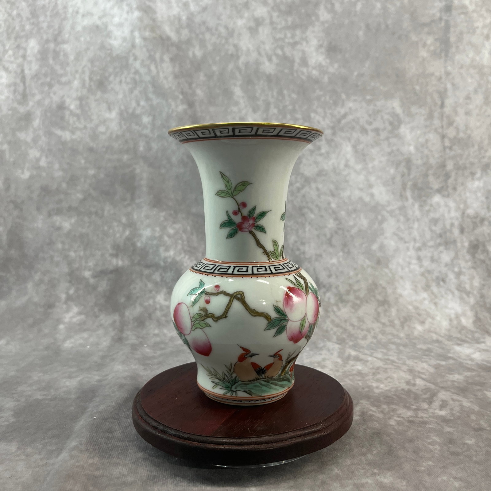 A FINE FAMILLE-ROSE GILT-RIMMED 'PEACH AND BIRD' PORCELAIN VASE