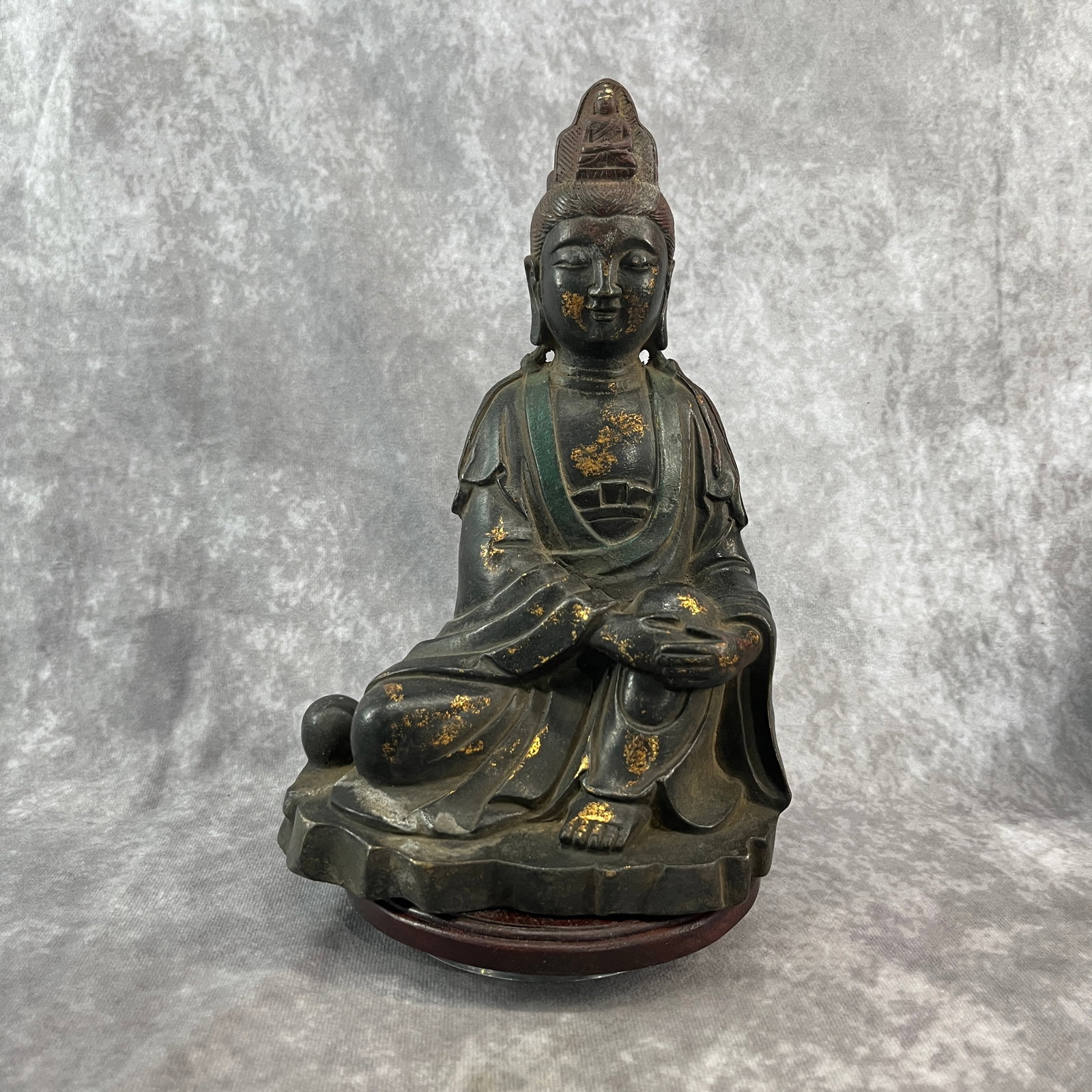 A FINE BRONZE SEATED GUANYIN (ROYAL EASE POSE): Qing Dynasty; Long: 6.4 inch; Width: 4.7 inch; High: 9.4 inch; Wooden base for diplay only
