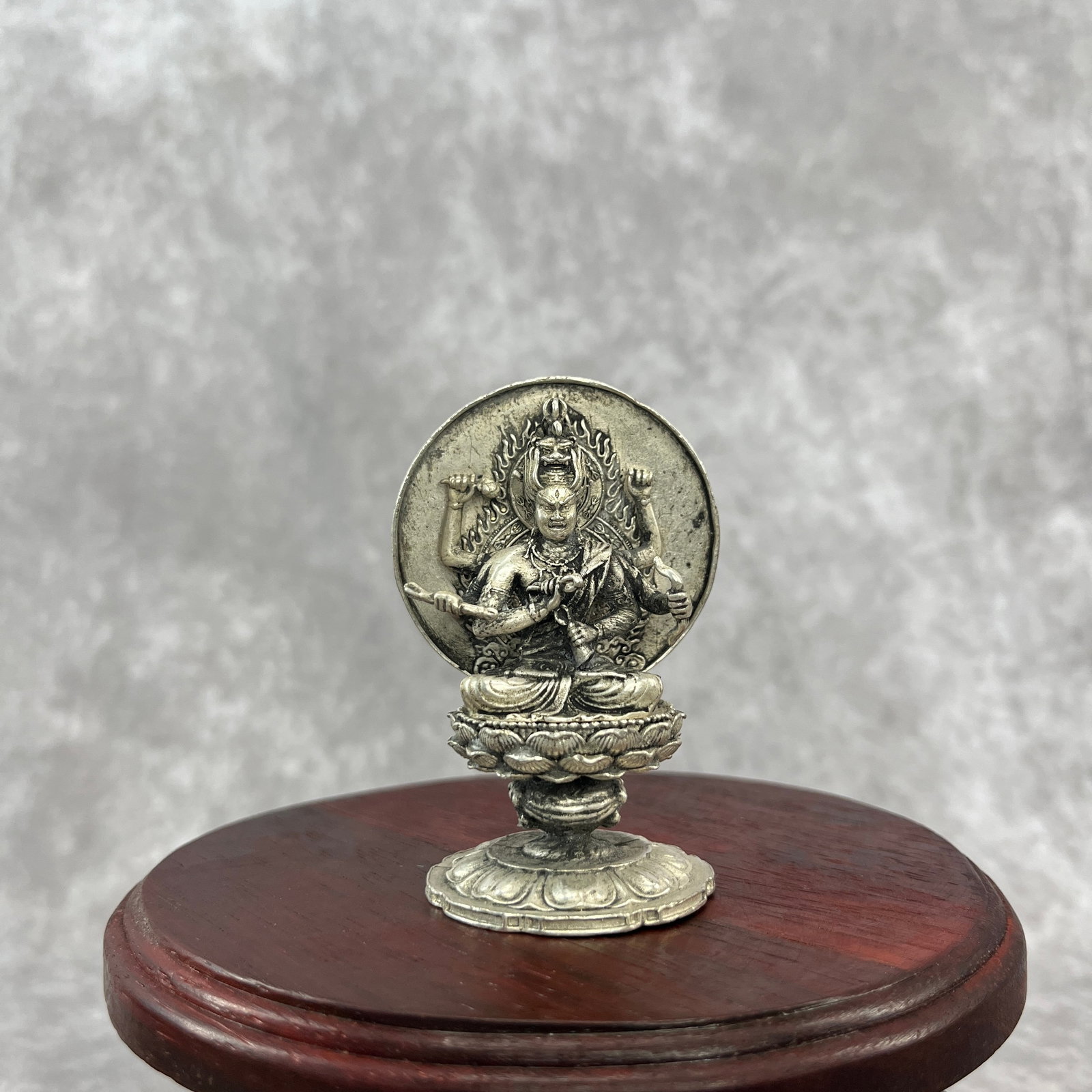 A SMALL WHITE BRONZE SIX ARM RAGARAJA STATUE: Qing Dynasty; Width: 1.95 inch; High: 2.9 inch; Wooden base for diplay only