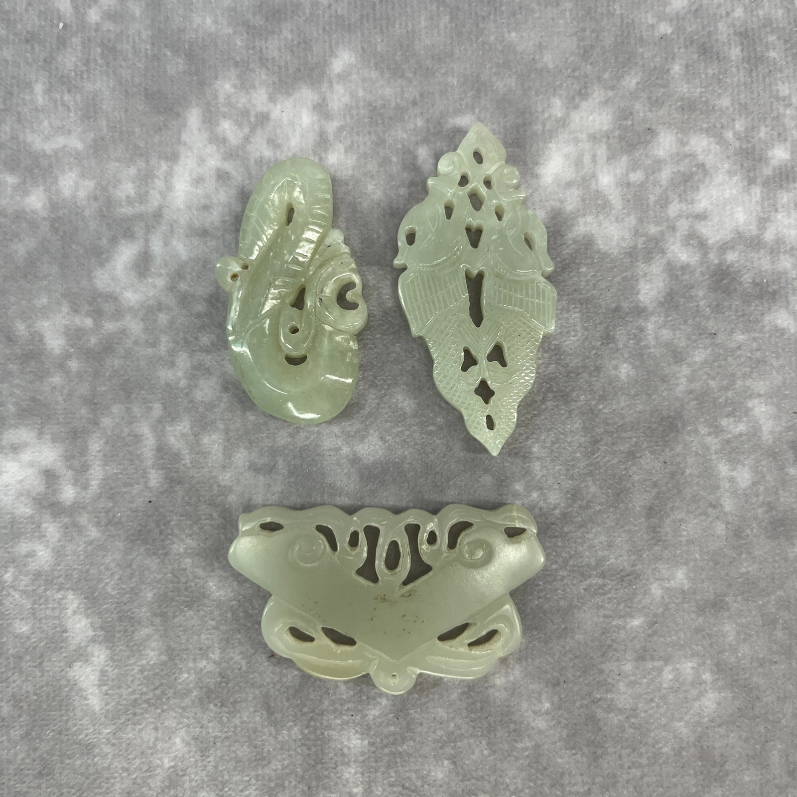 GROUP OF THREE HAND CARVED HETIAN JADE PENDANT