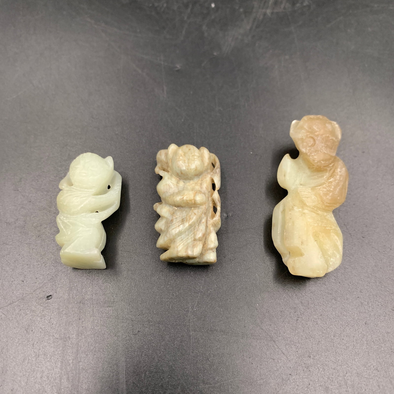 GROUP OF THREE HETIAN JADE PENDANT