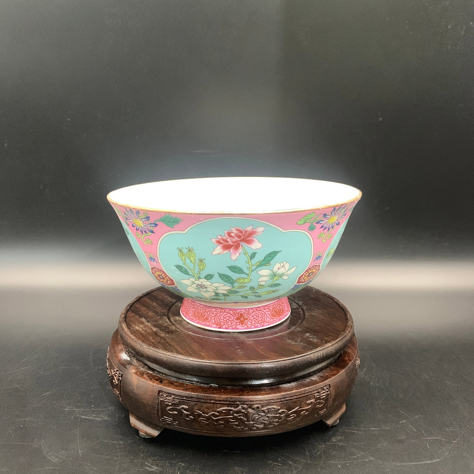 A FINE FAMILLE ROSE RUBY-GROUND SGRAFFITO 'FLORAL PANELS' BOWL