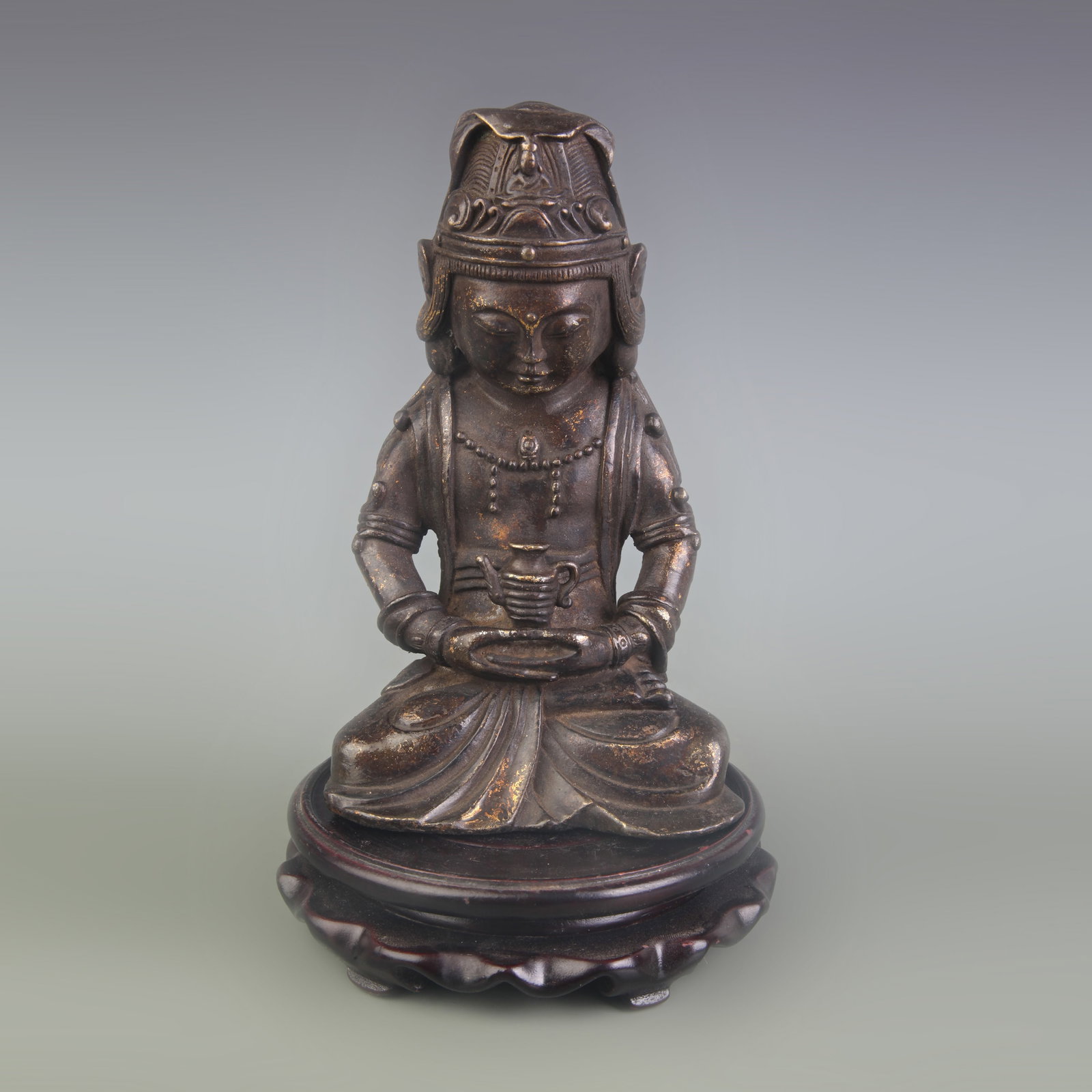 A FINE GILT PAINTED BRONZE SEATED FIGURE OF GUANYIN: Qing Dynasty; High: 6.9 inch; Wooden base for diplay only