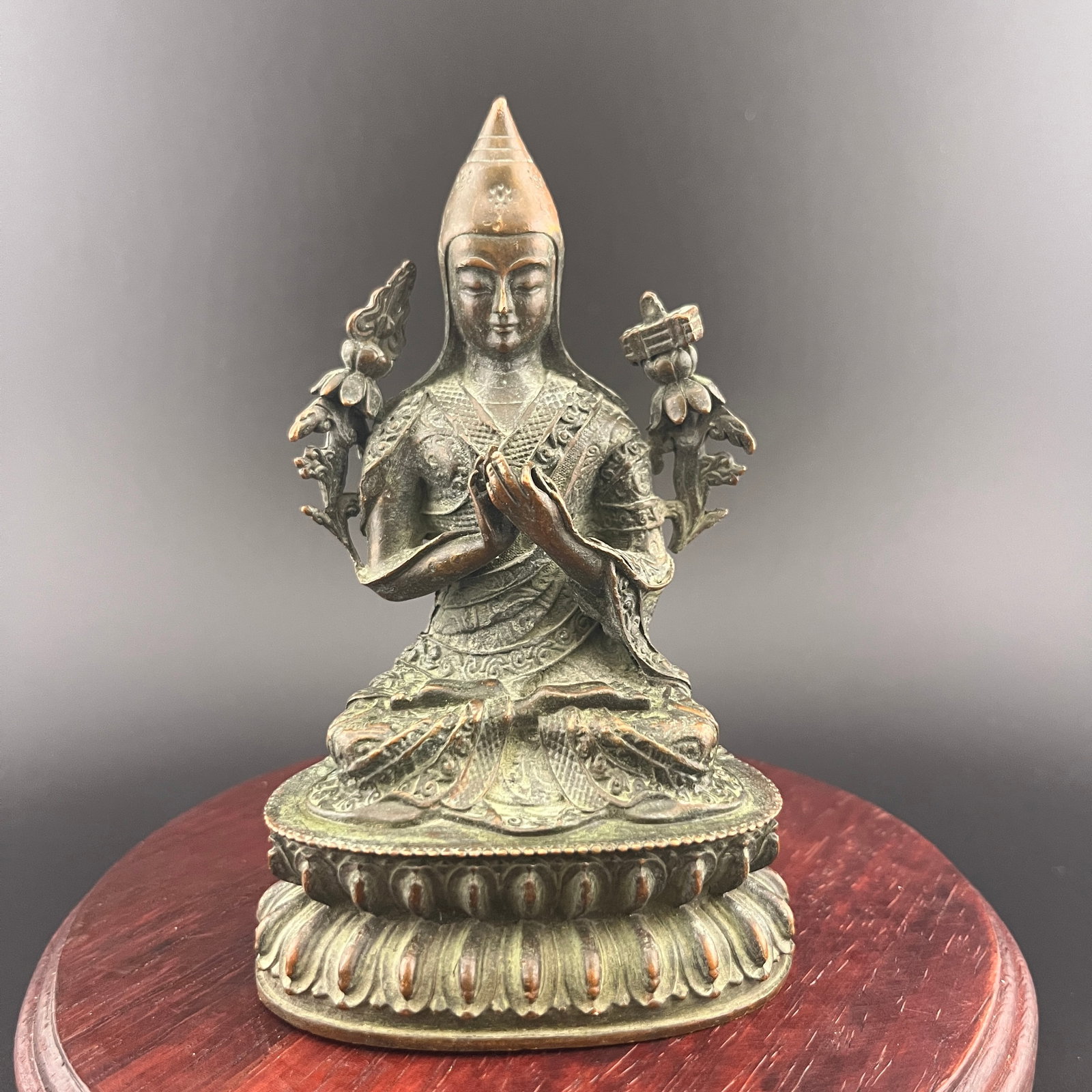 A SMALL BRONZE FIGURE OF JE TSONGKHAPA: 19th Century; Long: 2.8 inch; Width: 1.94 inch; High: 4.2 inch; Wooden base for diplay only