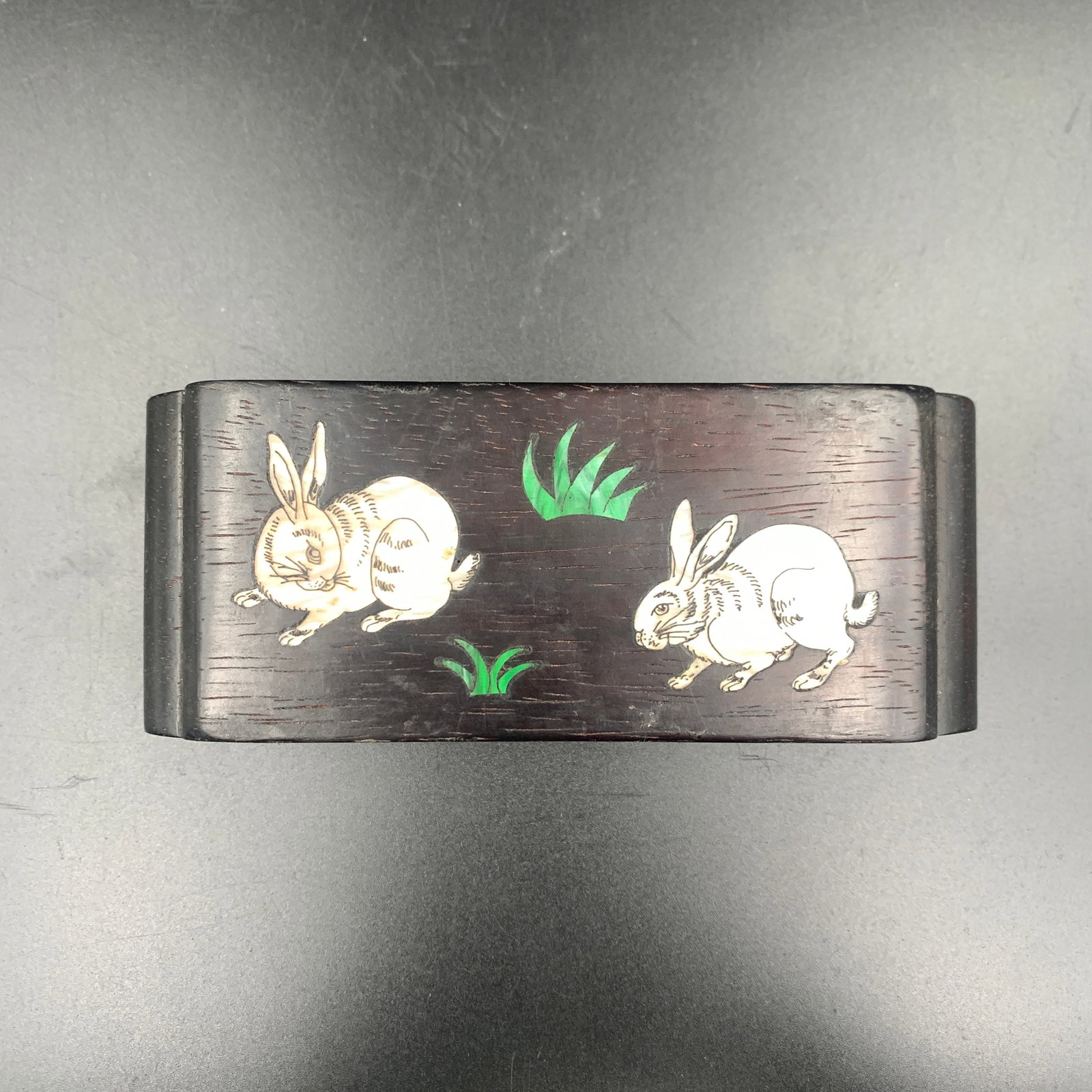 A FINE ZITAN WOOD STAND WITH INLAID RABBITS