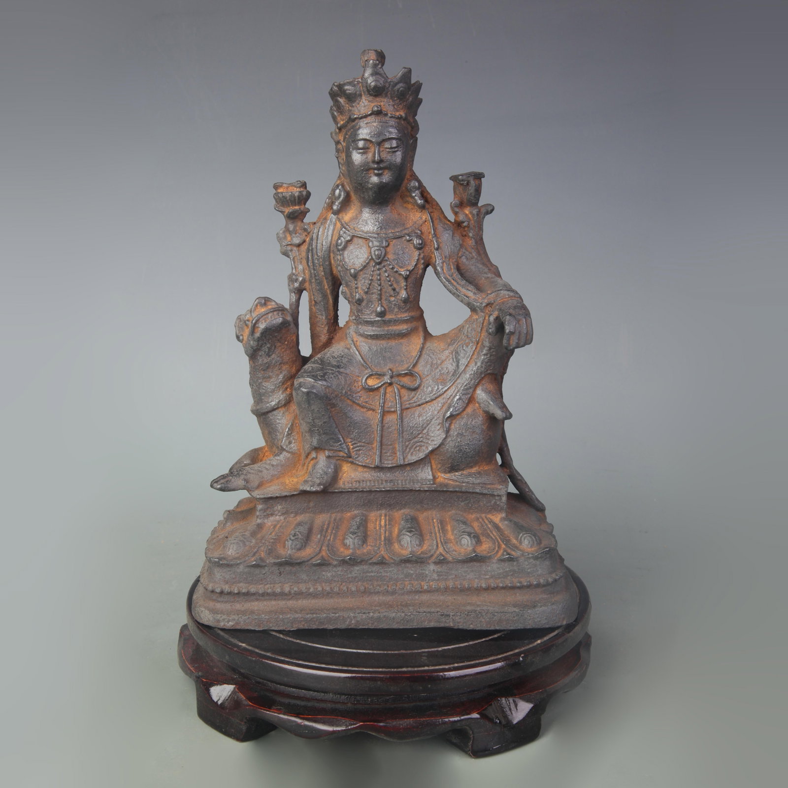 CAST IRON SEATED GUANYIN FIGURE ON MYTHICAL BEAD: Qing Dynasty; Width: 6.1 inch; High: 8.8 inch; Wooden base for diplay only