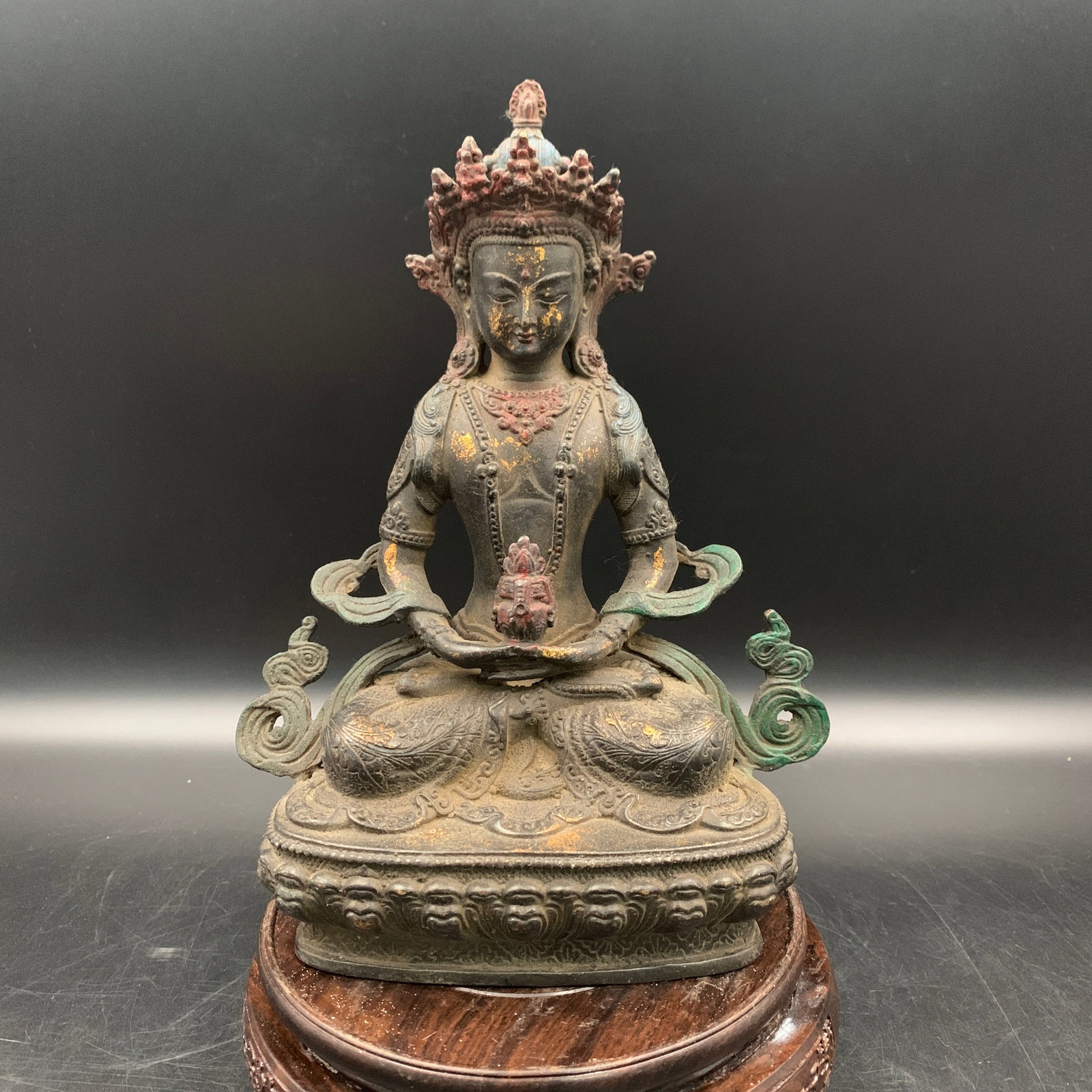 TIBETAN PATINATED AND GILT-BRONZE FIGURE OF AMITAYUS
