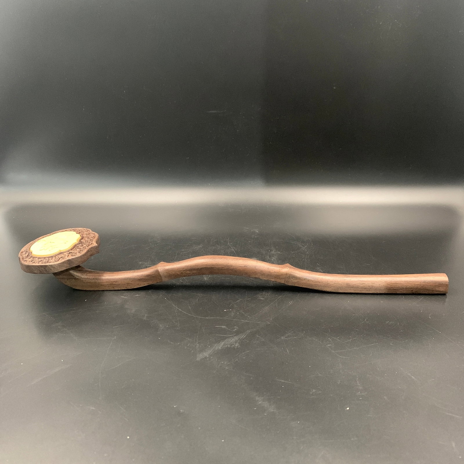 A FINE CARVED HARDWOOD AND INSET JADE RUYI SCEPTER: 20th Century; Long: 17.1 inch; Width: 3.9 inch; High: 2.1 inch; Wooden base for diplay only
