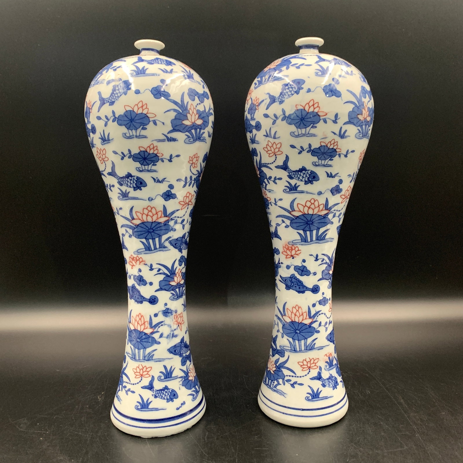 PAIR OF BLUE, WHITE, AND IRON-RED FISH-AND-LOTUS PORCELAIN VASES