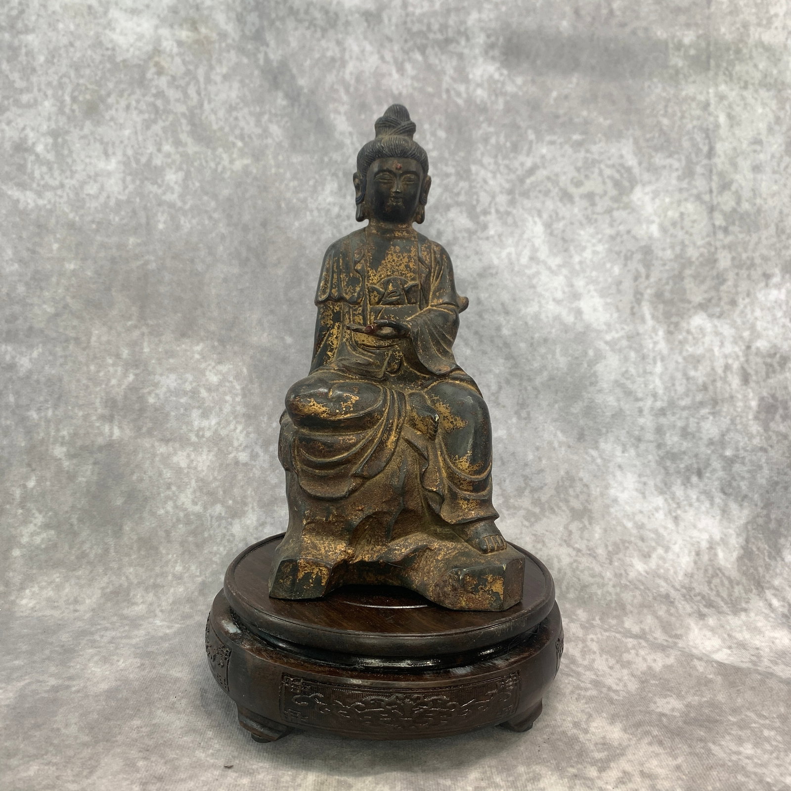 PARTIAL-GILT AND LACQUERED BRONZE FIGURE OF GUANYIN: Qing Dynasty; Long: 4.3 inch; Width: 3.7 inch; High: 8.5 inch; Wooden base for diplay only