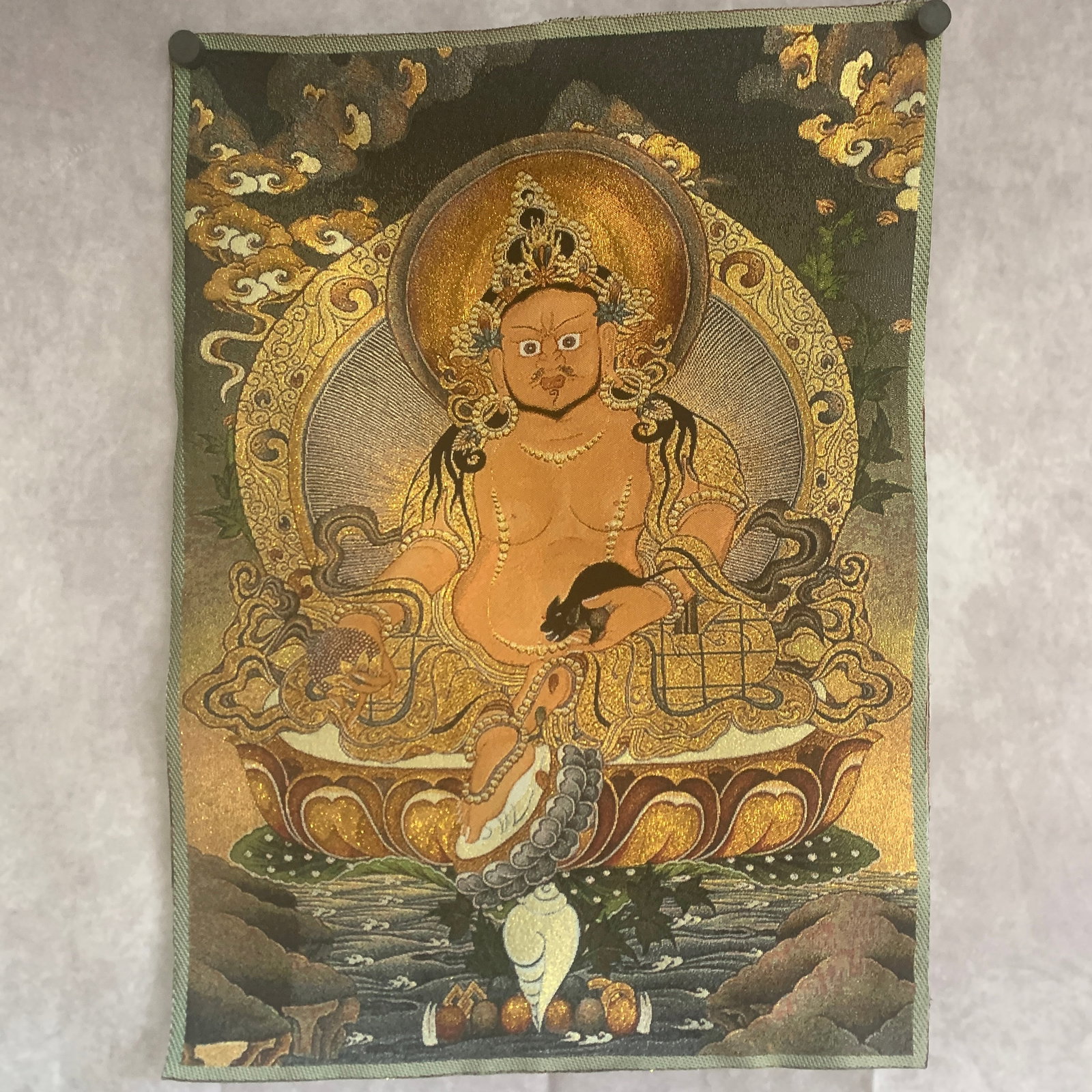 A FINE WOVEN BROCADE SILK THANGKA DEPICTING YELLOW JAMBHALA