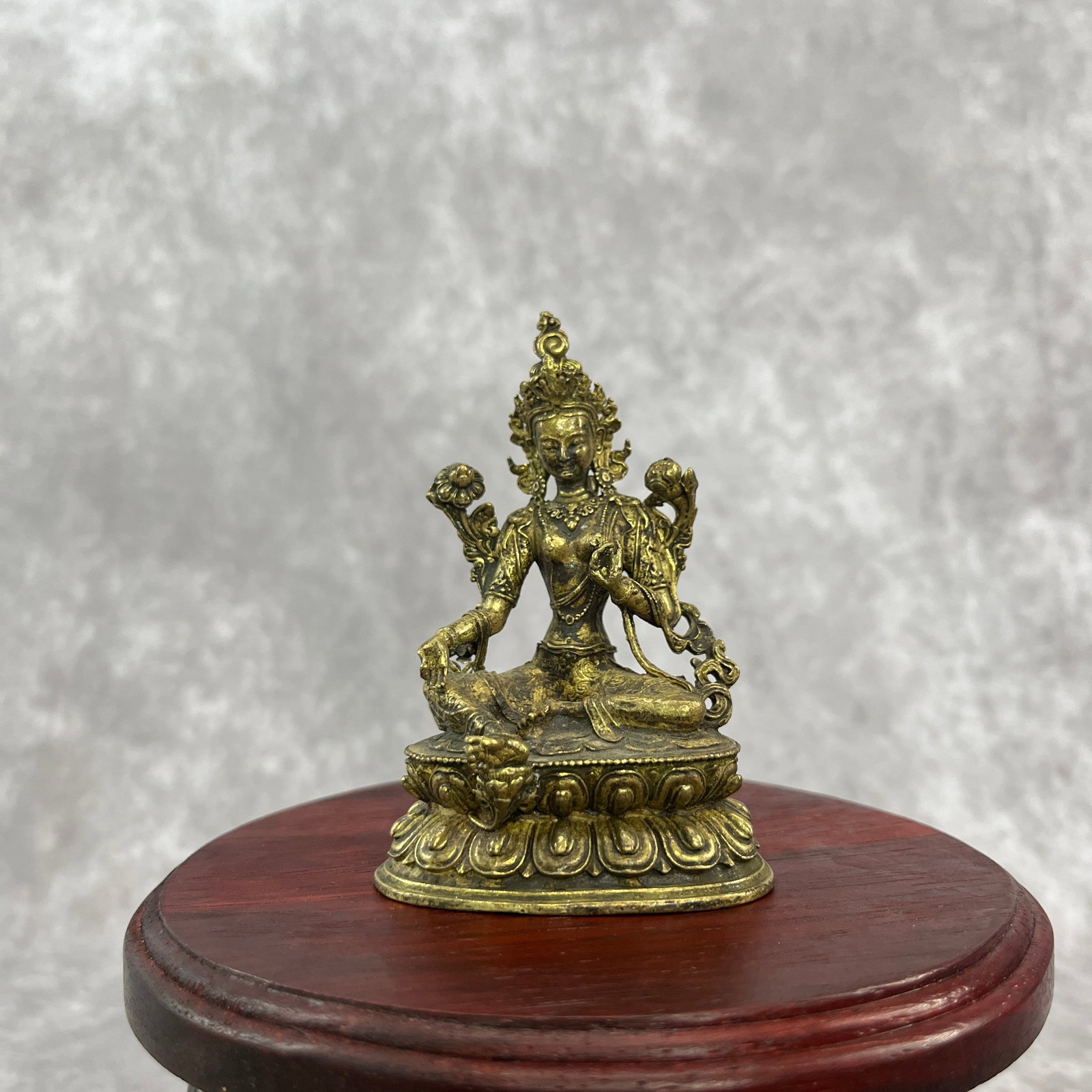 A SMALL BRONZE FIGURE OF GREEN TARA STATUE: Modern; Width: 2.3 inch; High: 3.4 inch; Wooden base for diplay only