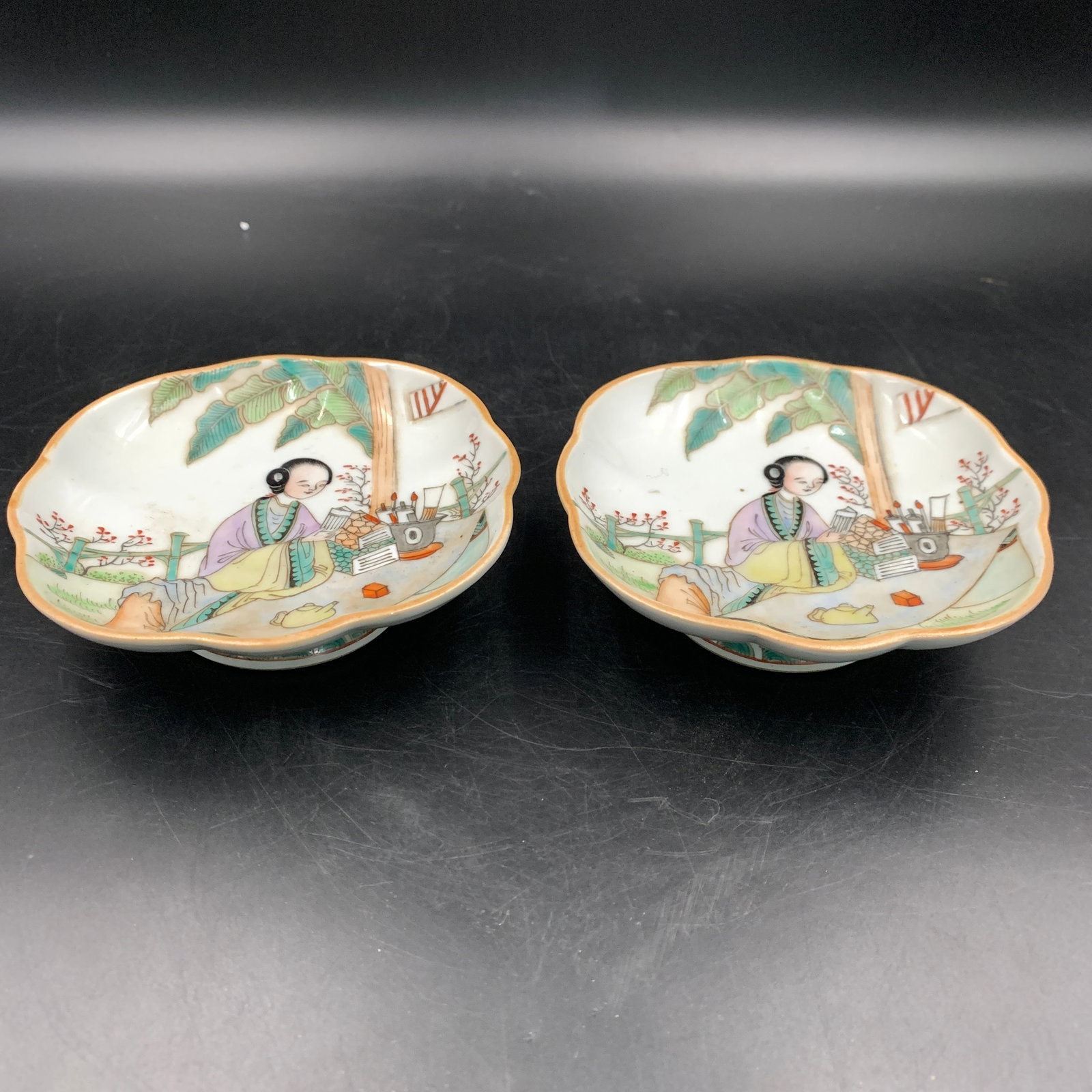 PAIR OF FAMILLE ROSE FOLIATE-RIM "SCHOLAR-LADY" SMALL DISHES