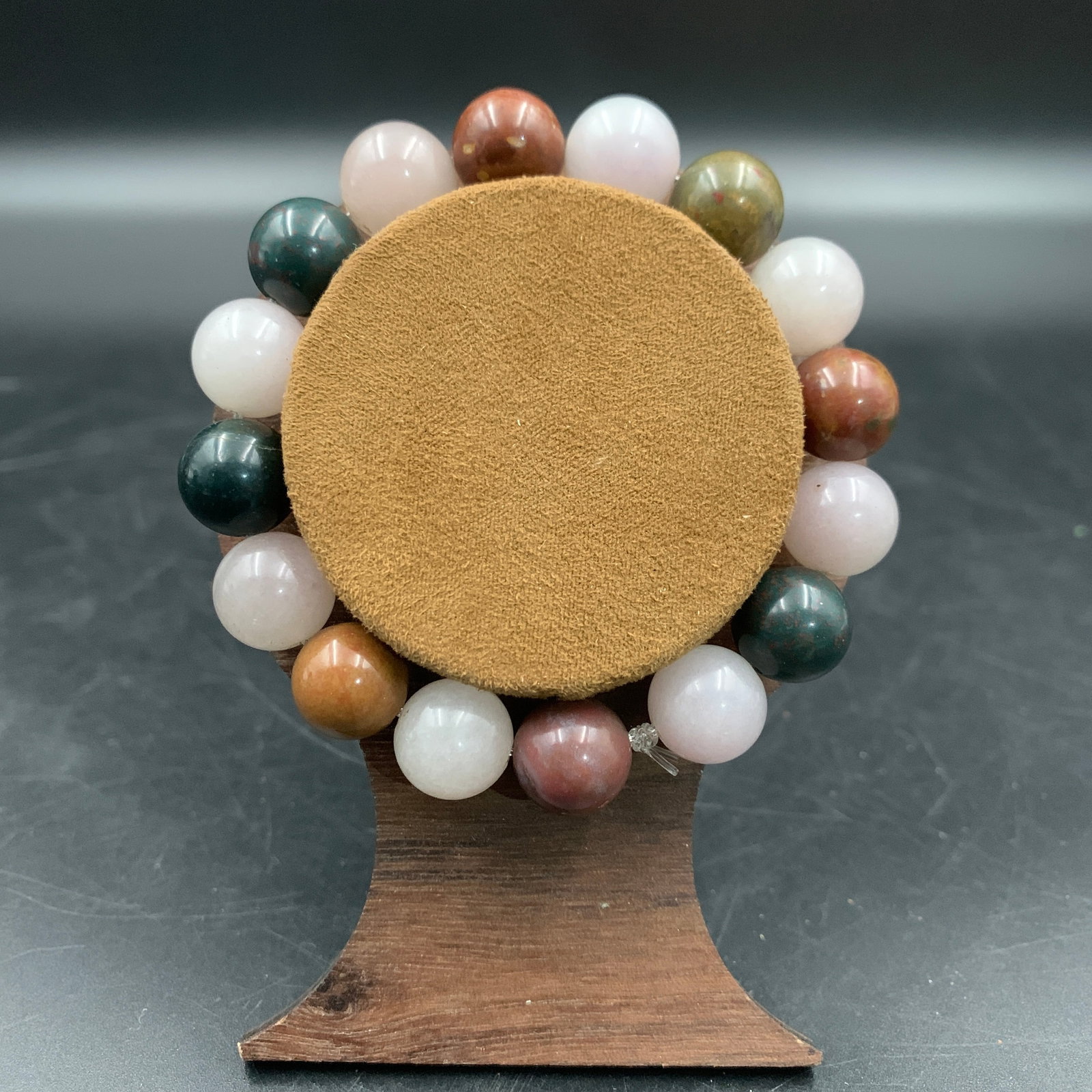 A FINE MULTI-COLORED GEMSTONE BRACELET: Modern; Long: 3.5 inch; Diameter: 0.4 inch