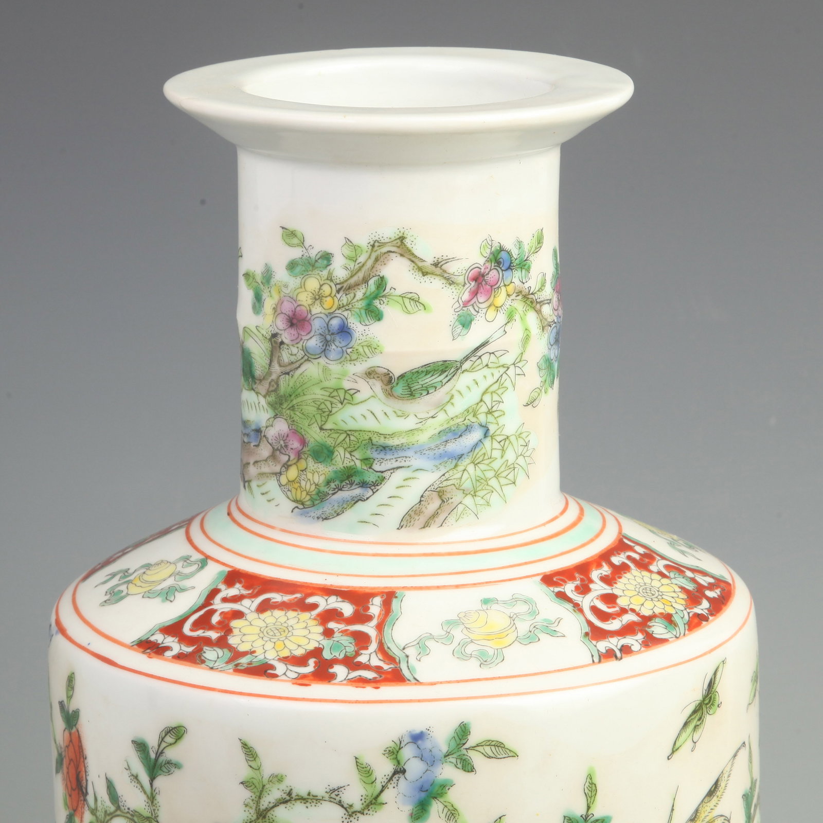 FAMILLE ROSE FLORAL AND BIRD PATTERN CLUB SHAPED PORCELAIN VASE: Qing Dynasty Kang Xi Period; High: 16.81 inch; Width: 7.5 inch; Wooden base for diplay only